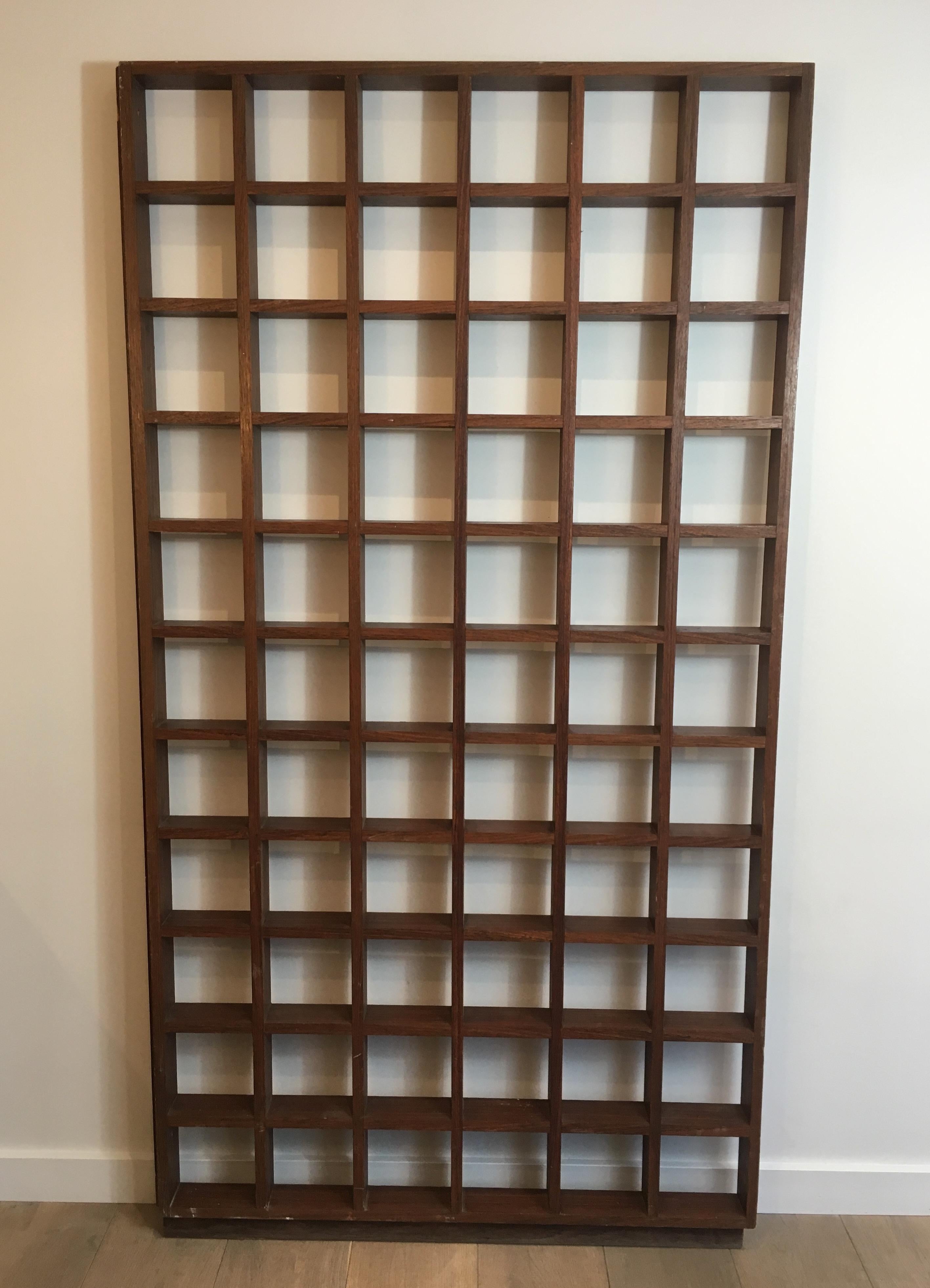 This very nice separation shelf is made of exotic wood. This is a very simple design, a French work, Circa 1970.