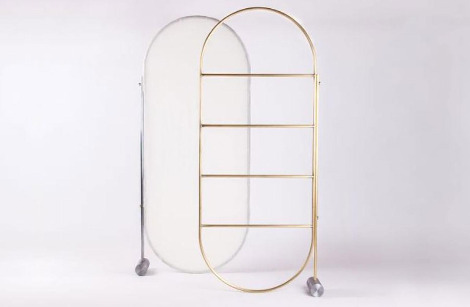 Separé eoom divider by Omri Revesz & Damian Tatangelo for Mingardo. Separè is a multi-use room divider, created with a metal frame that stands out visually and geometrically with a tubular weight that works as a foundation. Separè is formed of