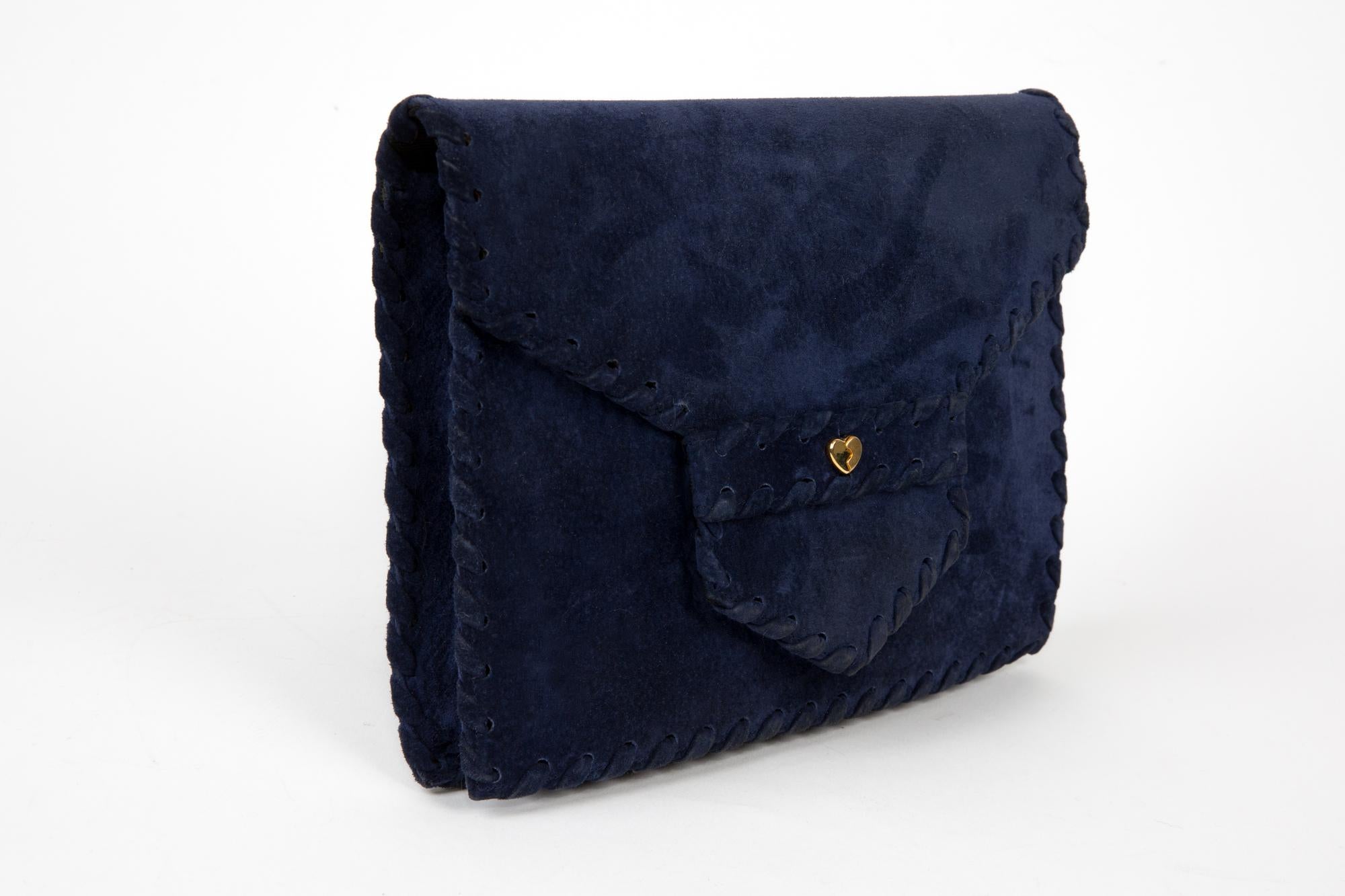 Sepcoeur blue suede leather large clutchbag featuring gold-tone front heart opening with an under snap, an envelope shape, a leather braided finishing, an inside black silk lining and a zipped pocket.  
Length at Bottom 10.2in (26cm)
Height: 7.8in.