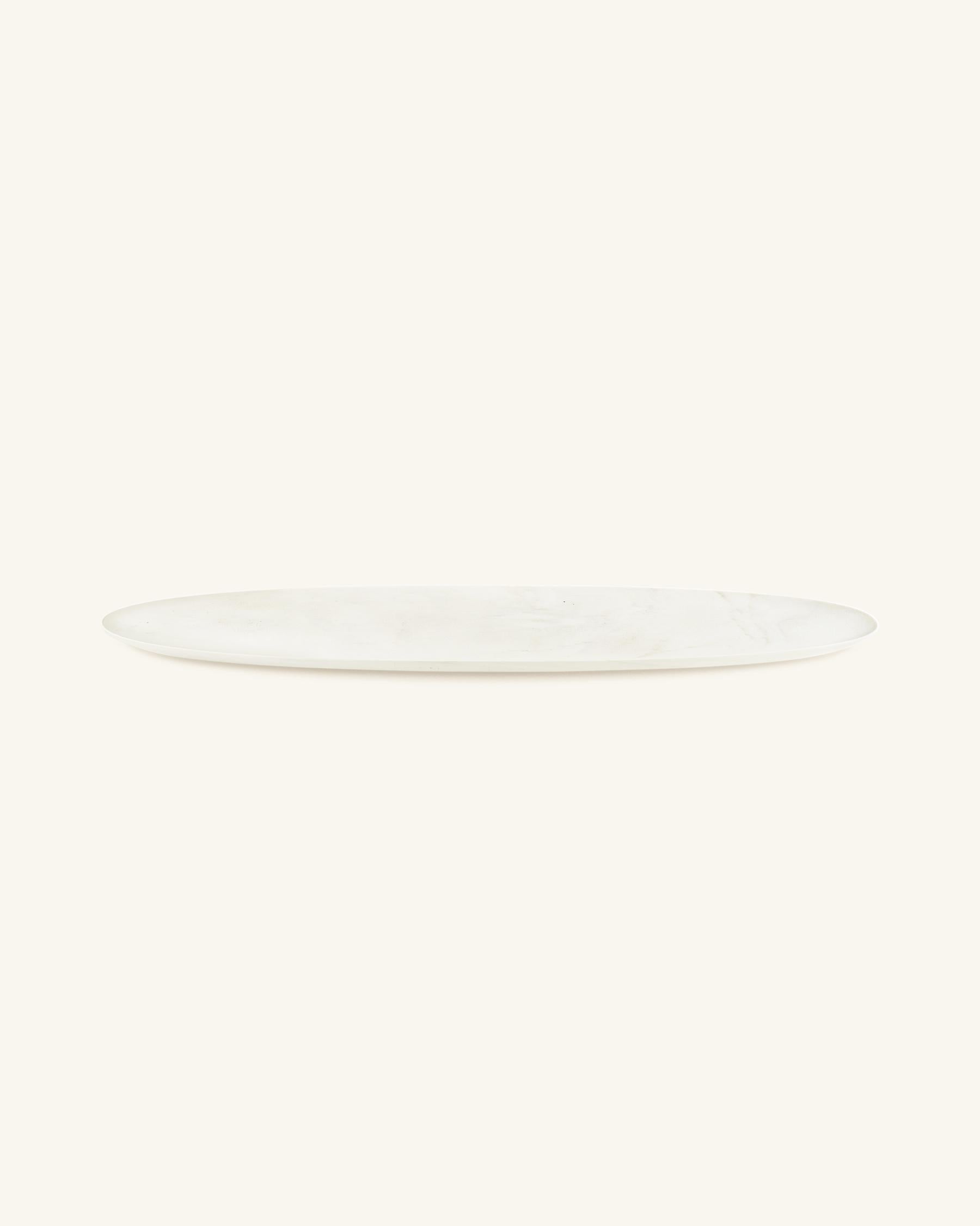 Sepia tray by Homefolks
Dimensions: D 31.5 x W 115 x H 3.5 cm 
Materials: Cremo Delicato marble.

A sculptural tray with spectacular dimensions, Sepia is inspired by cuttlebones scattered on the beach at low tide. Bold and minimal, its