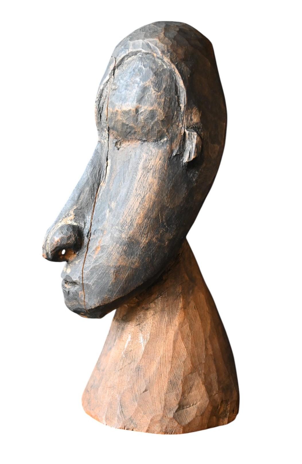 Sepik River (Keram River tributary), Papua New Guinea
Ancestral Bust (Male Ancestor Figure)
Wood, with age cracks and dark matte patina
Height: 24 cm, base diameter 10.5 cm
Period: Mid-20th century (c. 1940–1960)

Carved wooden bust representing a