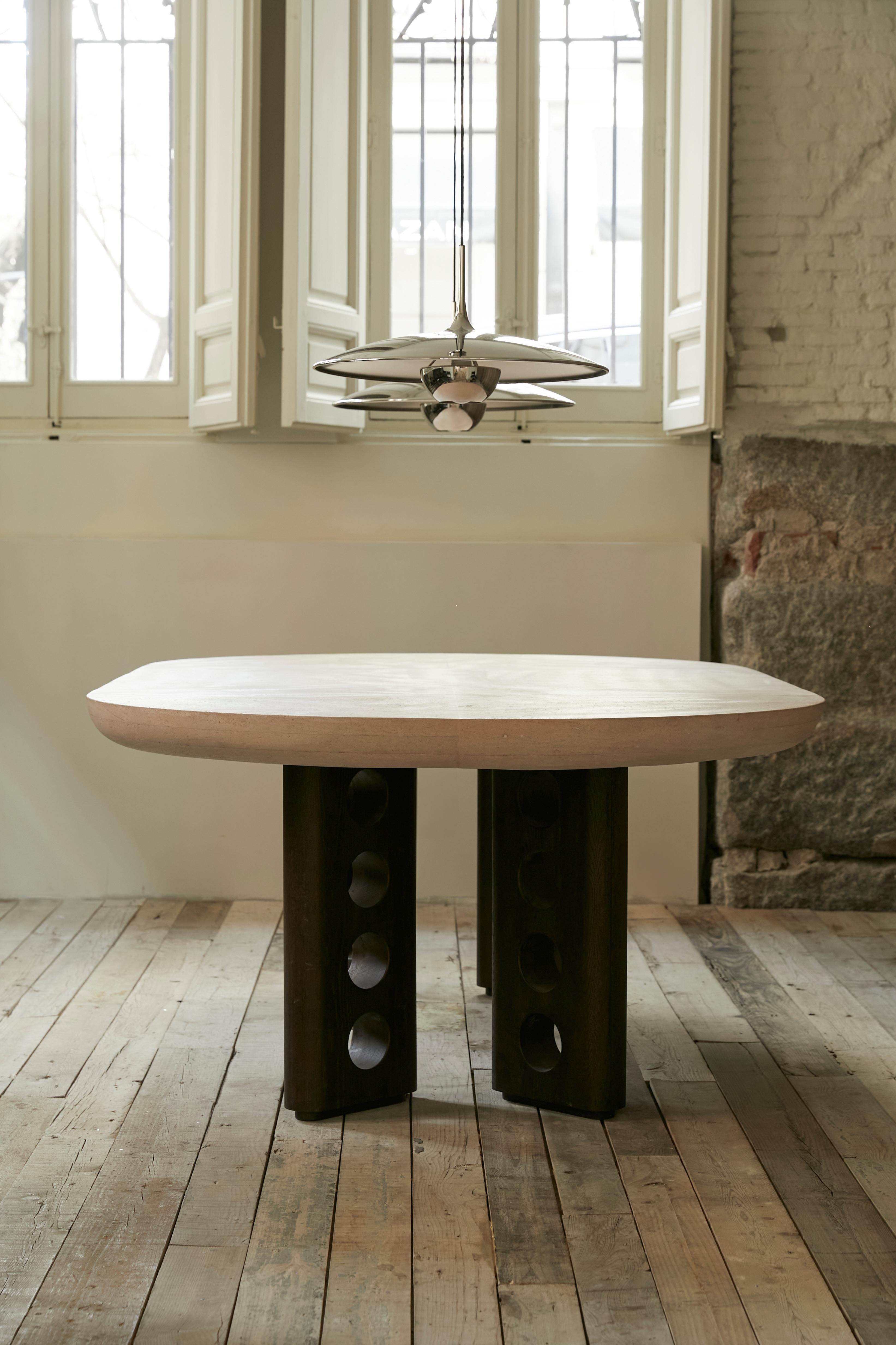 Sepúlveda stone dining table designed by S+DLH. With handcarved walnut legs and Stone tabletop, this table is completely customizable, as both the dimentions and the type of stone can be changed to adapt to any taste or need. 7670