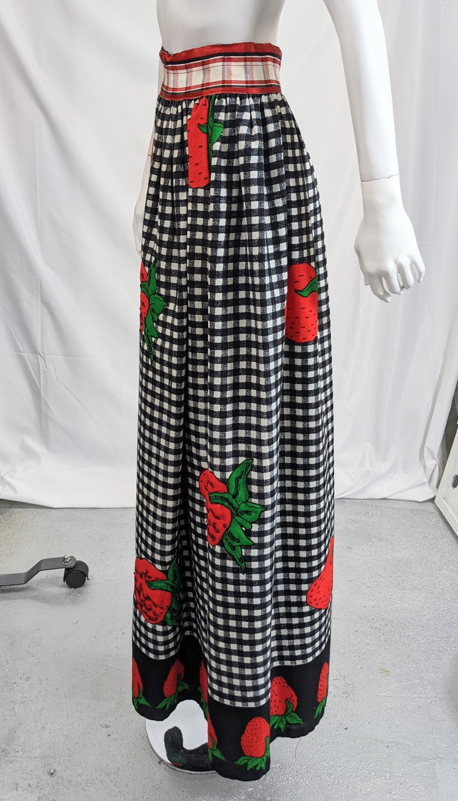 Sequined Strawberry Hostess Skirt from the 1960's. Select strawberries are over sequined in red and green on the front of the skirt. Simple gathered waist in light weight wool blend with black rayon lining. 
25