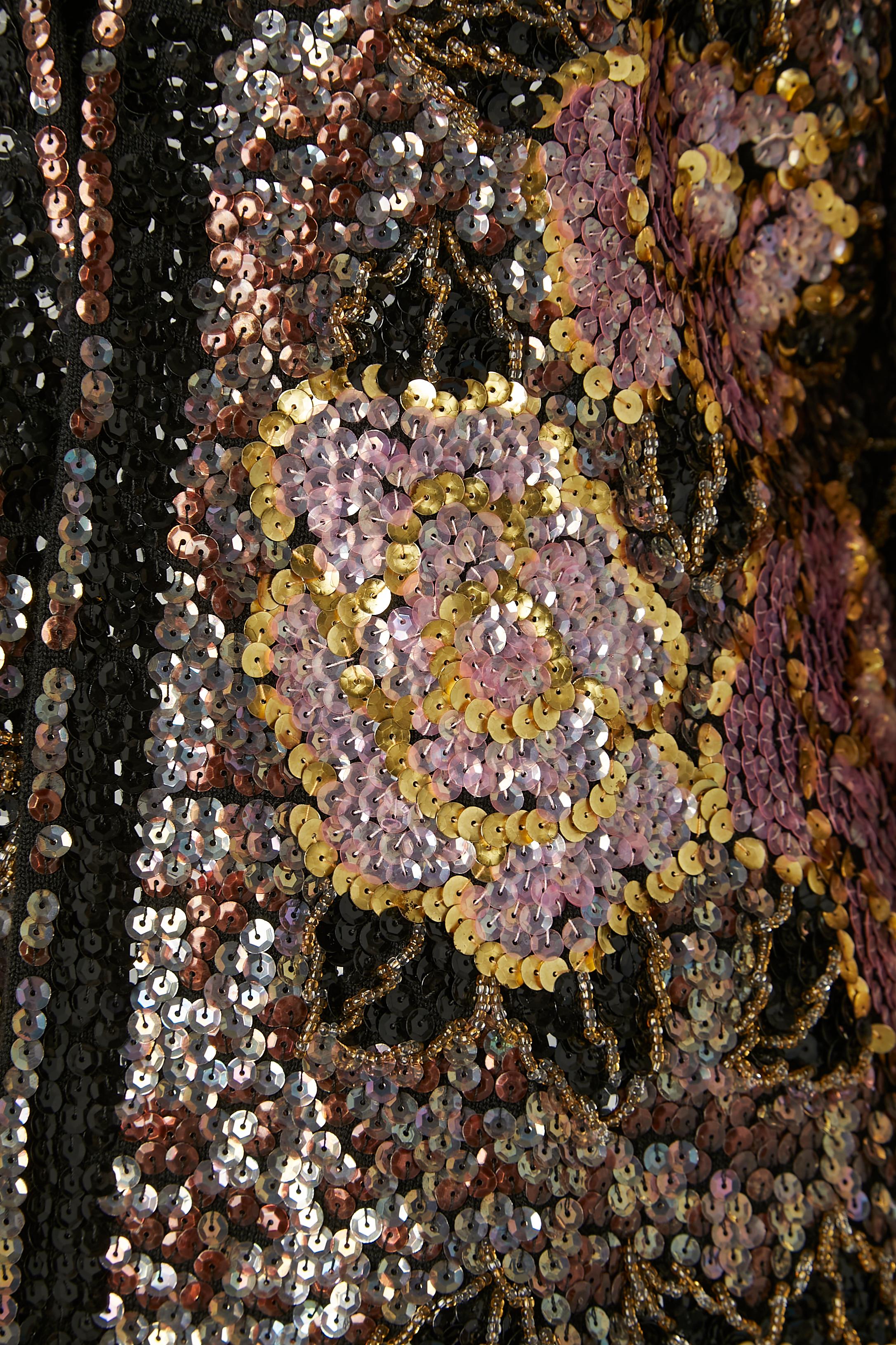 Sequin and beadwork edge to edge evening jacket with flower pattern. No fabric tag composition but the lining is probably rayon or acetate and the inside edge on the front is in black knit. 
One hook&eye closure. 
SIZE 40 /L 