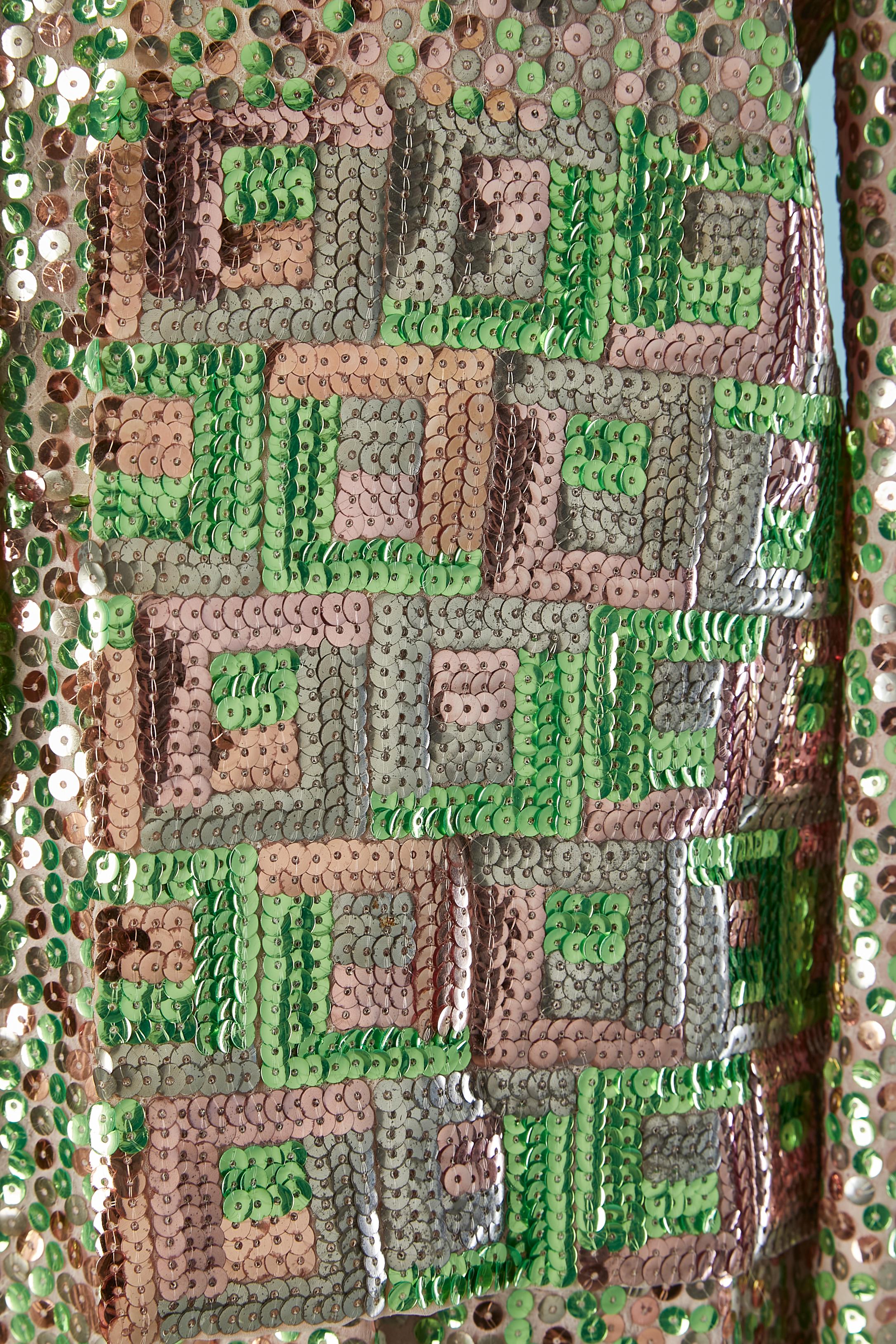 Sequin jacket and dress ensemble. No fabric composition tag but the lining is probably acetate. One hook&eye closure on the top middle front. 
Zip closure on the middle back of the dress + hook&eye. 
SIZE M 