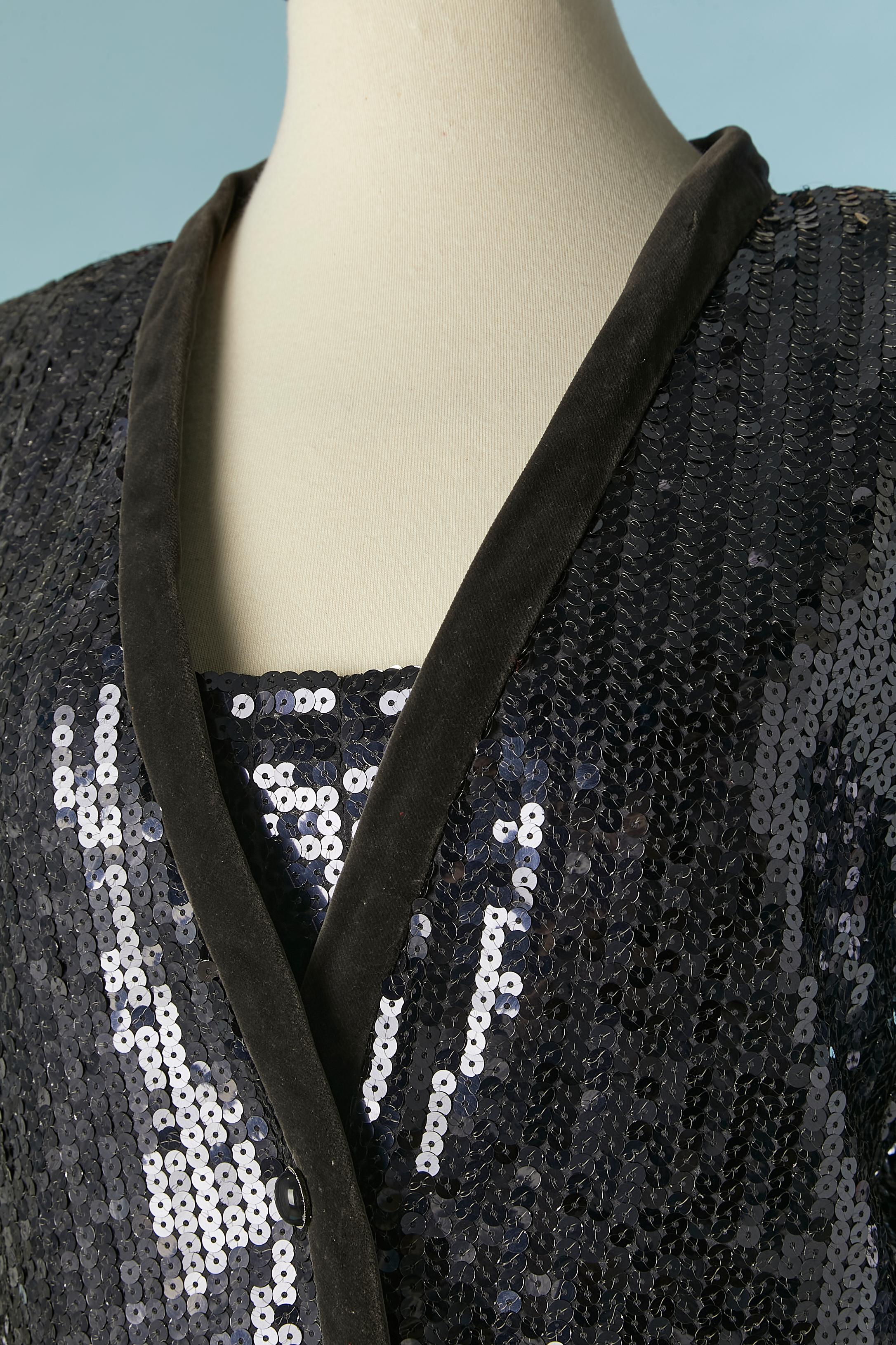 Sequin jacket and dress ensemble with velvet edge ( on the jacket) and shoulder straps ( on the dress). Silk lining inside the jacket and polyester lining inside the dress. 
Shoulder pad. Button and buttonhole closure on the middle front on the