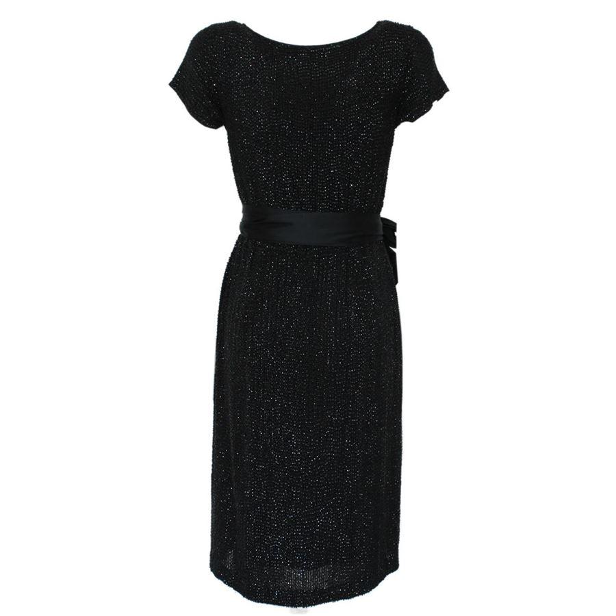 Silk Black color Completely covered by sequins Short sleeve With belt Total lenght from shoulder cm 100 (39.4 inches)
