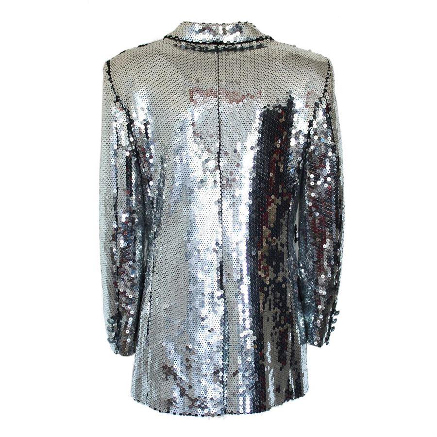 Rare and exclusive piece Moschino Cheap and Chic Vintage of early 90's Sequins Silver color Four pockets Three authomatic buttons Length from shoulder cm 67 (26.3 inches)
