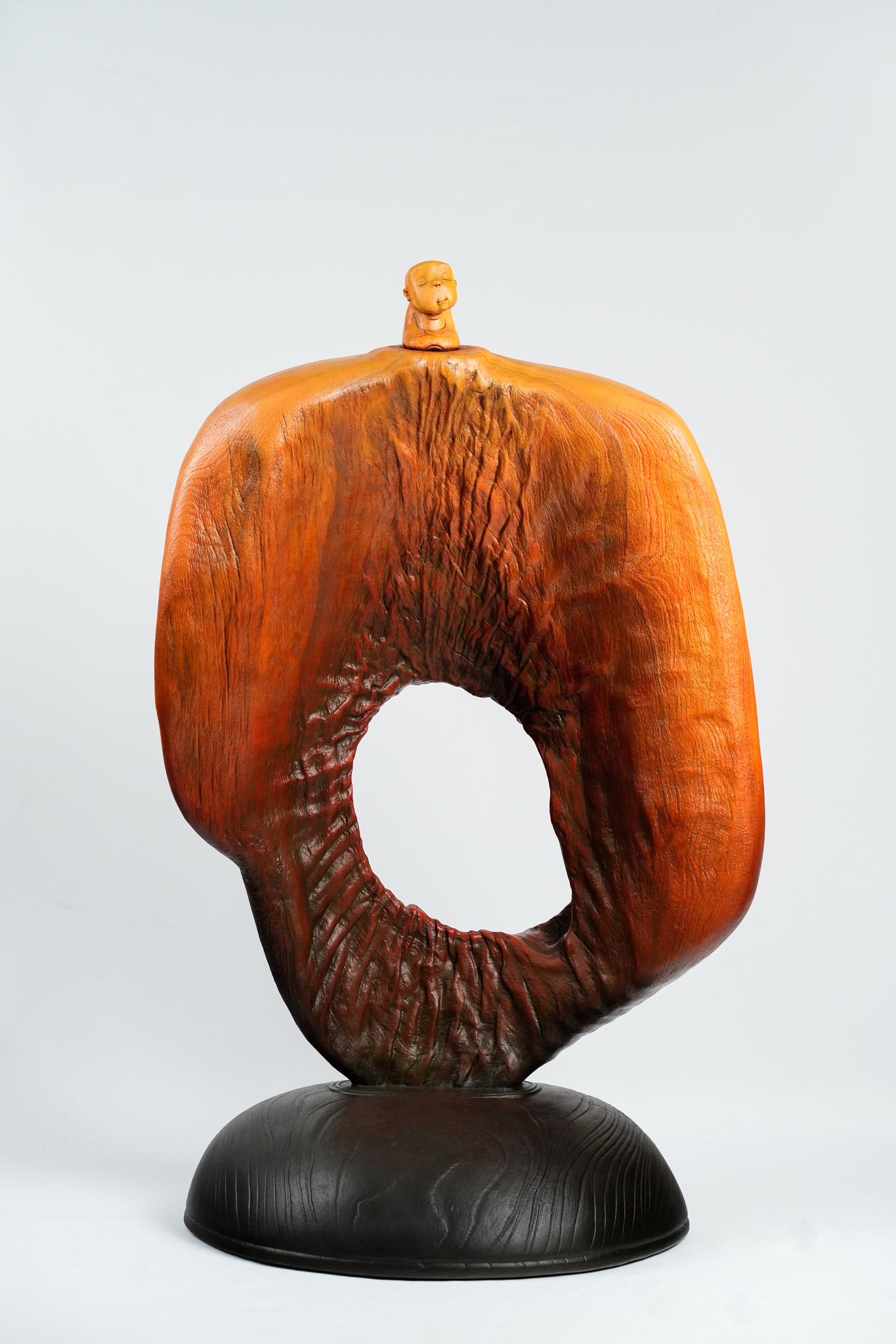 Designer
s Note:

Visual Impact: This sculpture is a masterclass in negative space. The large central void creates a "window" that allows light and air to pass through, preventing the substantial wood form from feeling too heavy visually. It serves