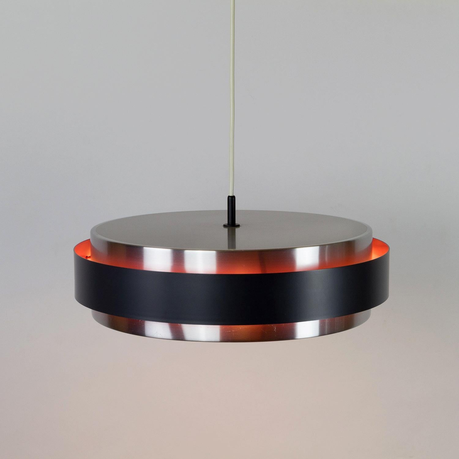 Aluminium Sera light designed by Jo Hammerborg for Danish lighting manufacturer Fog & Mørup. Part of the Saturn Series, the light is made up of three rings. Two are brushed aluminium and the third is lacquered aluminium with a black outer and hot