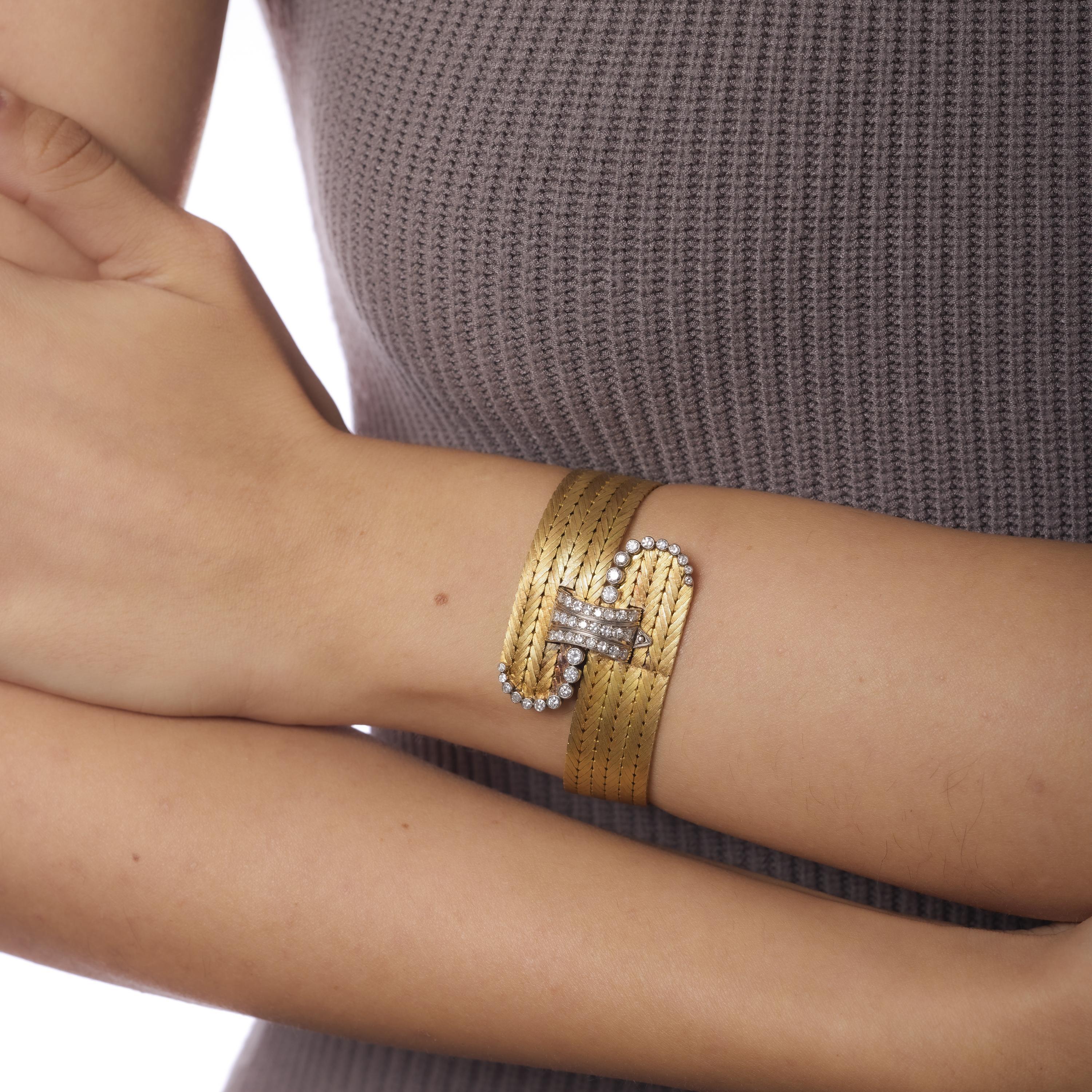 This Mid Century Italian bracelet by Serafino Brevetto dazzles with a buckle motif set with 34 mixed-cut diamonds, totaling 1.30 carats. Crafted in 18k yellow and white gold, the bold 1960s design merges playful sophistication with Italian