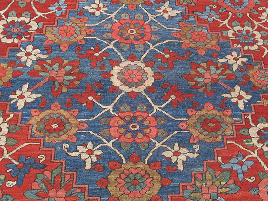 Serapi carpets from Northwest Persia are renowned for their balance of bold and playful drawing. This exceptional piece uses the traditional layout of a medallion set within a field with corner spandrels but layers the entire composition with an