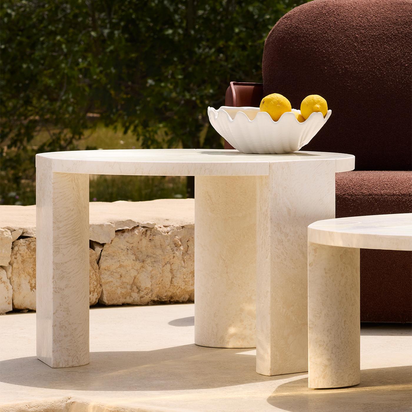 Geometric volumes cleverly combined in an elegant interlocking structure defines this superb coffee table, making for a luminous addition to refined patios or terraces. A superb synthesis from Morandi's paintings inspired its sculptural and bright