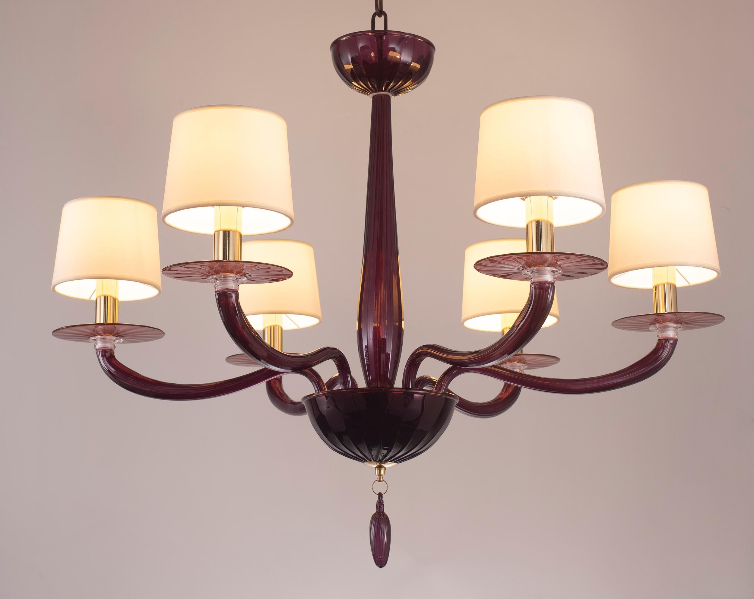 Serenade chandelier 6 Lights Aubergine Murano glass, white handmade cotton lampshades by Multiforme
Serenade collection is inspired by a contemporary and international design, simple but not banal, and consists of elements studied in minute detail.
