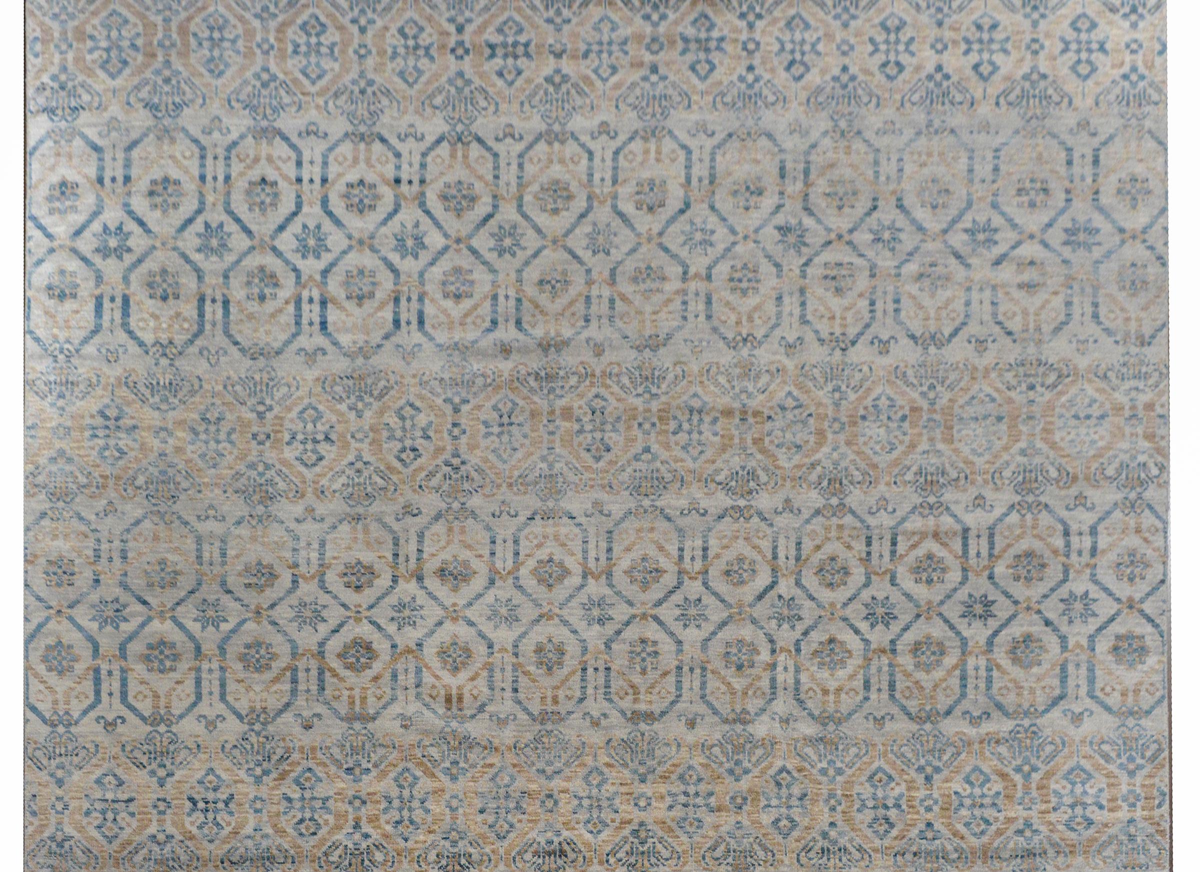 A serene contemporary handwoven Indian rug with an all-over lattice and floral pattern woven in wonderful shades of blue and cream.