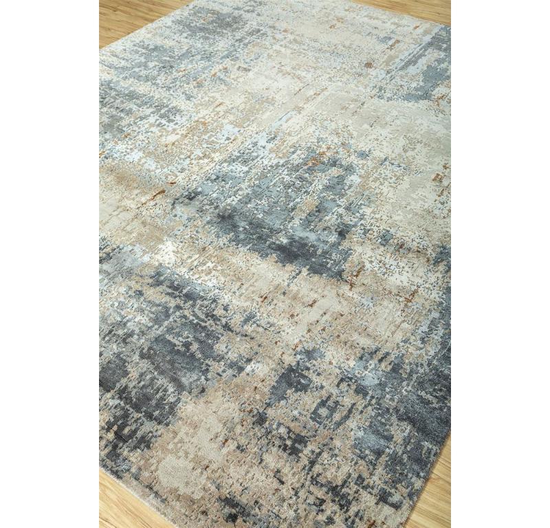 This handknotted rug by blends modern design with calming tranquility, beckoning you to explore its abstract depths. Woven with premium yarns in an inviting ivory, the rug features a mesmerizing interplay of mesh textures and abstract motifs.