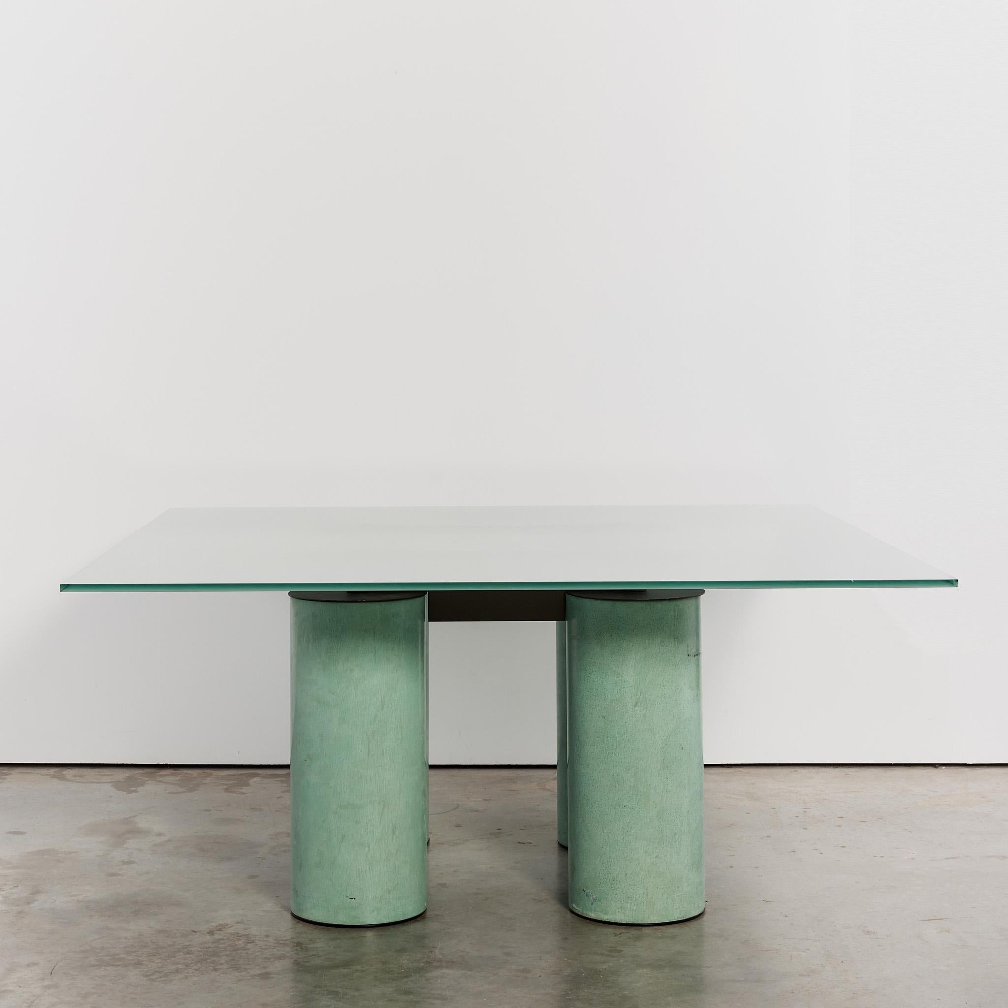 The Serenissimo square board room table by Massimo & Lella Vignelli for Acerbis. With its distinctive column legs and frosted glass top, this oversized version is suitable as a statement board room table or can have the glass replaced for a dining