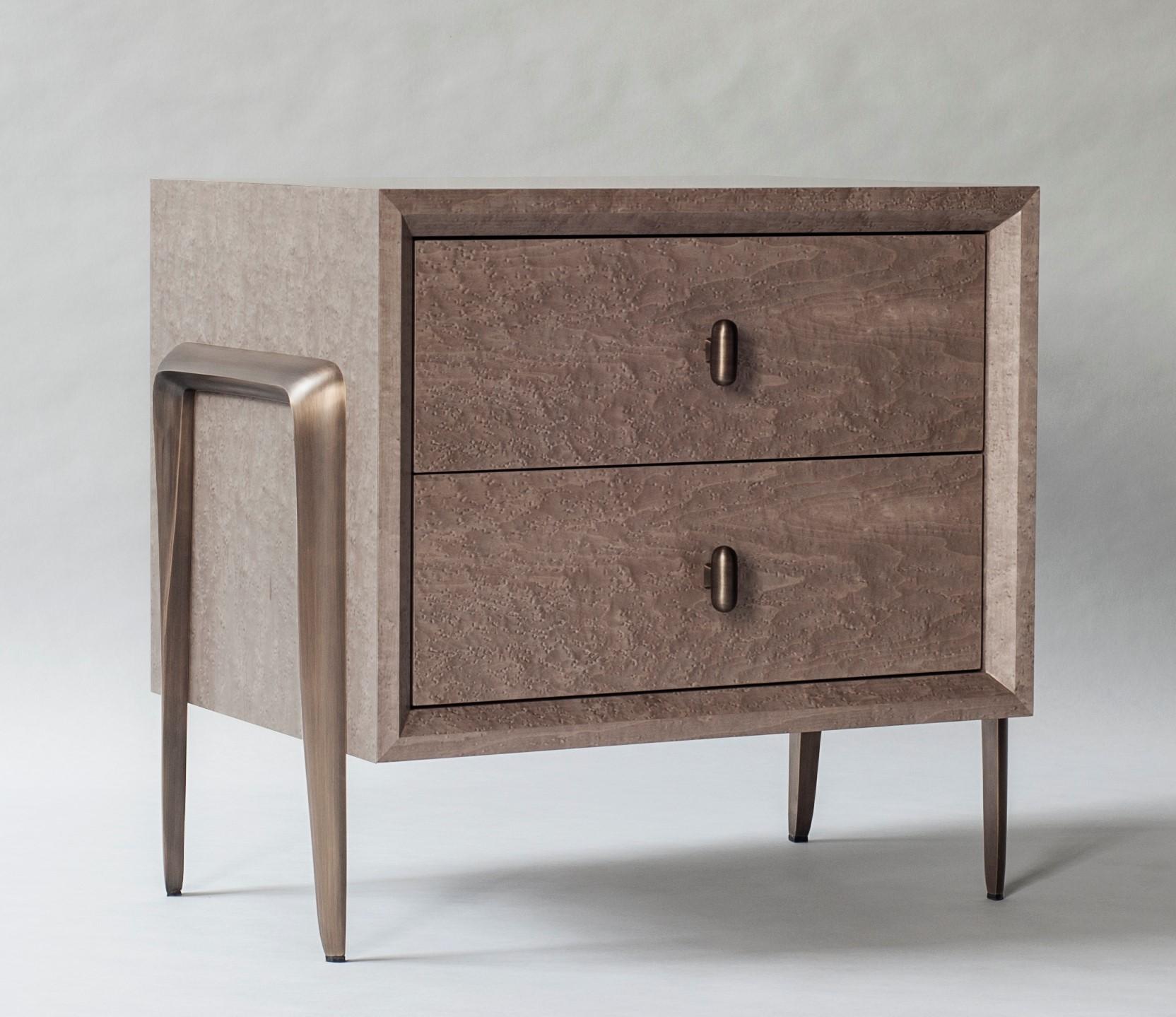 Serge bedside table by DeMuro Das 
Dimensions: w 67.4 x d 47.8 x h 61 cm
Materials: Birds eye maple (Clay)
 Solid bronze - Antique

Dimensions and finishes can be customized

DeMuro Das is an international design firm and the aesthetic and