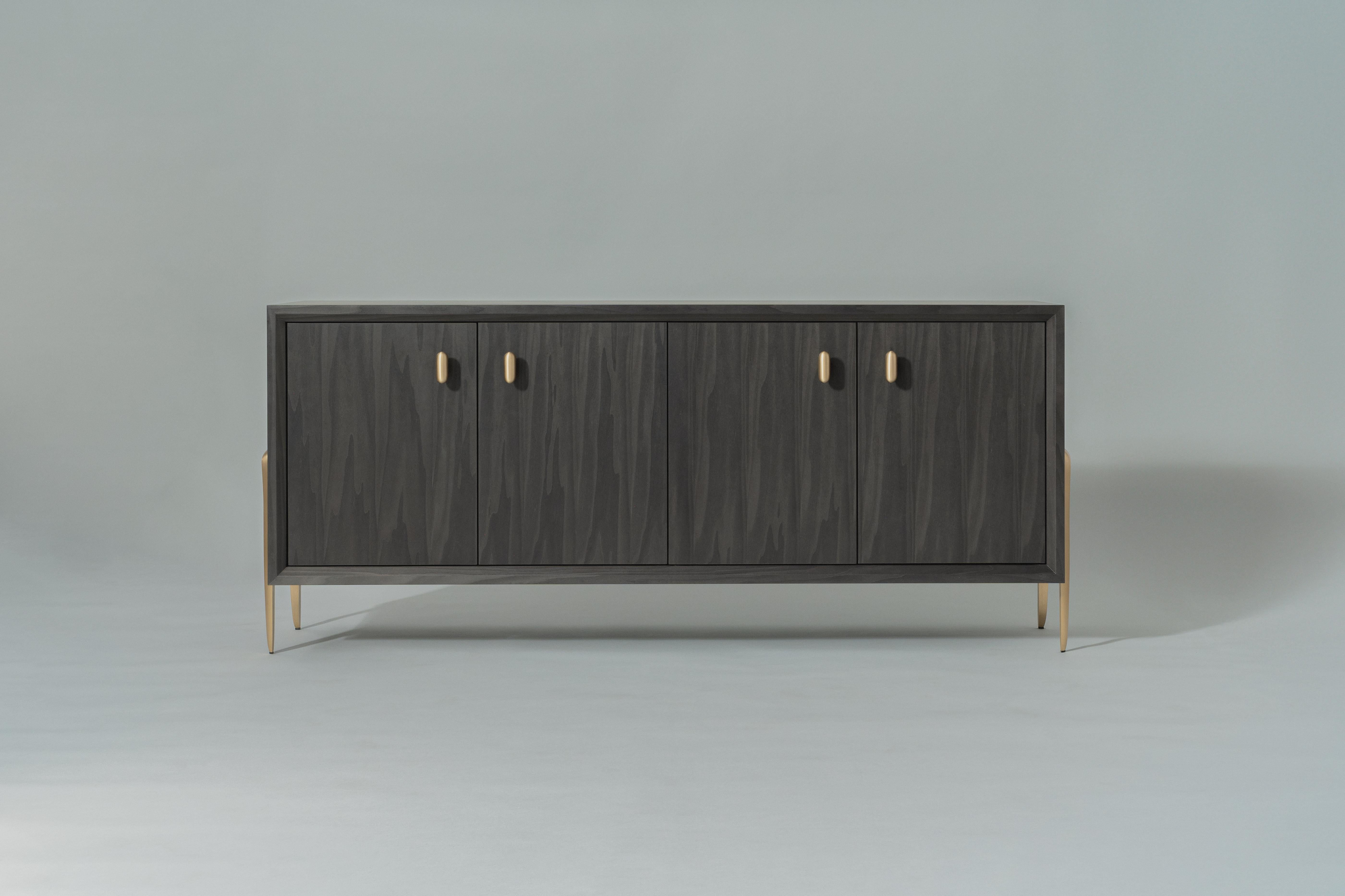 Informed by the refined craftsmanship of mid-century Italian design, the Serge Cabinet features sculptural two-legged brackets, with a gently tapered silhouette and articulated edge. Nuanced millwork - beveled along the interior frame, with four