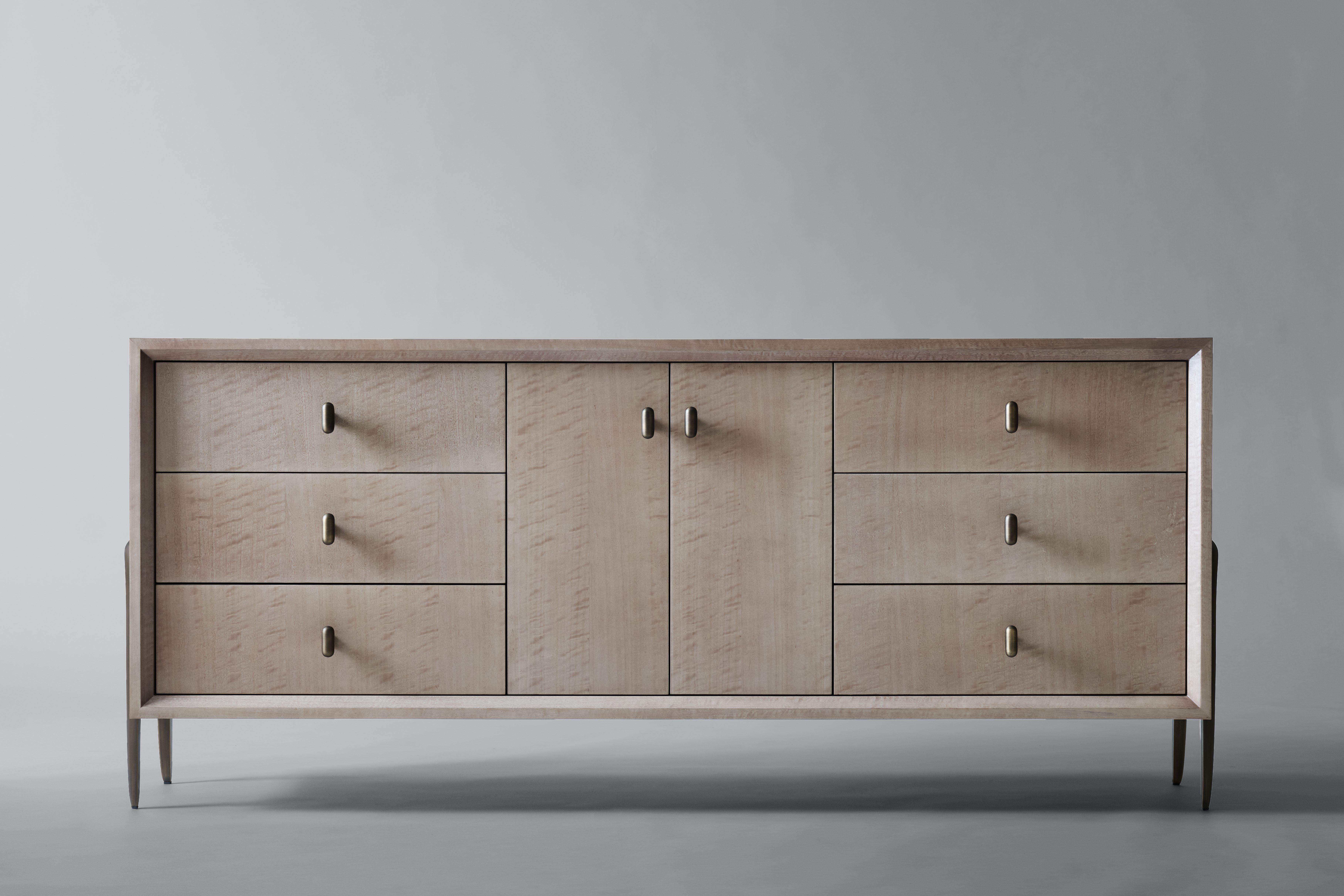 Informed by the refined craftsmanship of mid-century Italian design, the Serge Credenza features sculptural two-legged brackets, with a gently tapered silhouette and articulated edge. Nuanced millwork - beveled along the interior frame, with six