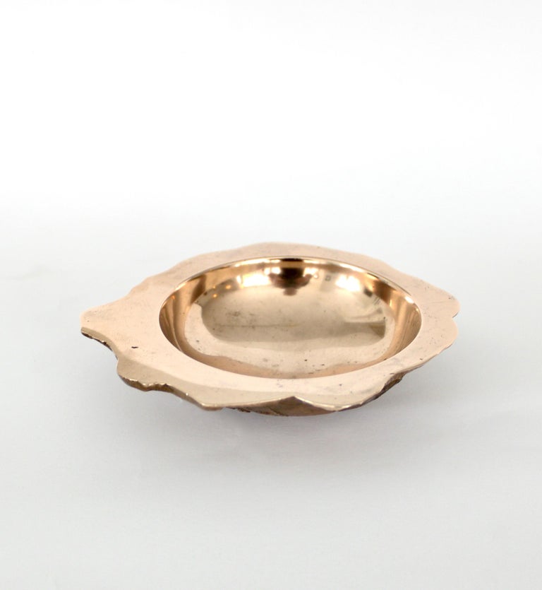 Serge Mansau decorative bronze dish or vide poche produced by French company Monique Gerber 
Art du Bronze. 
Highly polished bronze interior with high relief sculptural underside. The intentional irregular edge makes this vide poche more