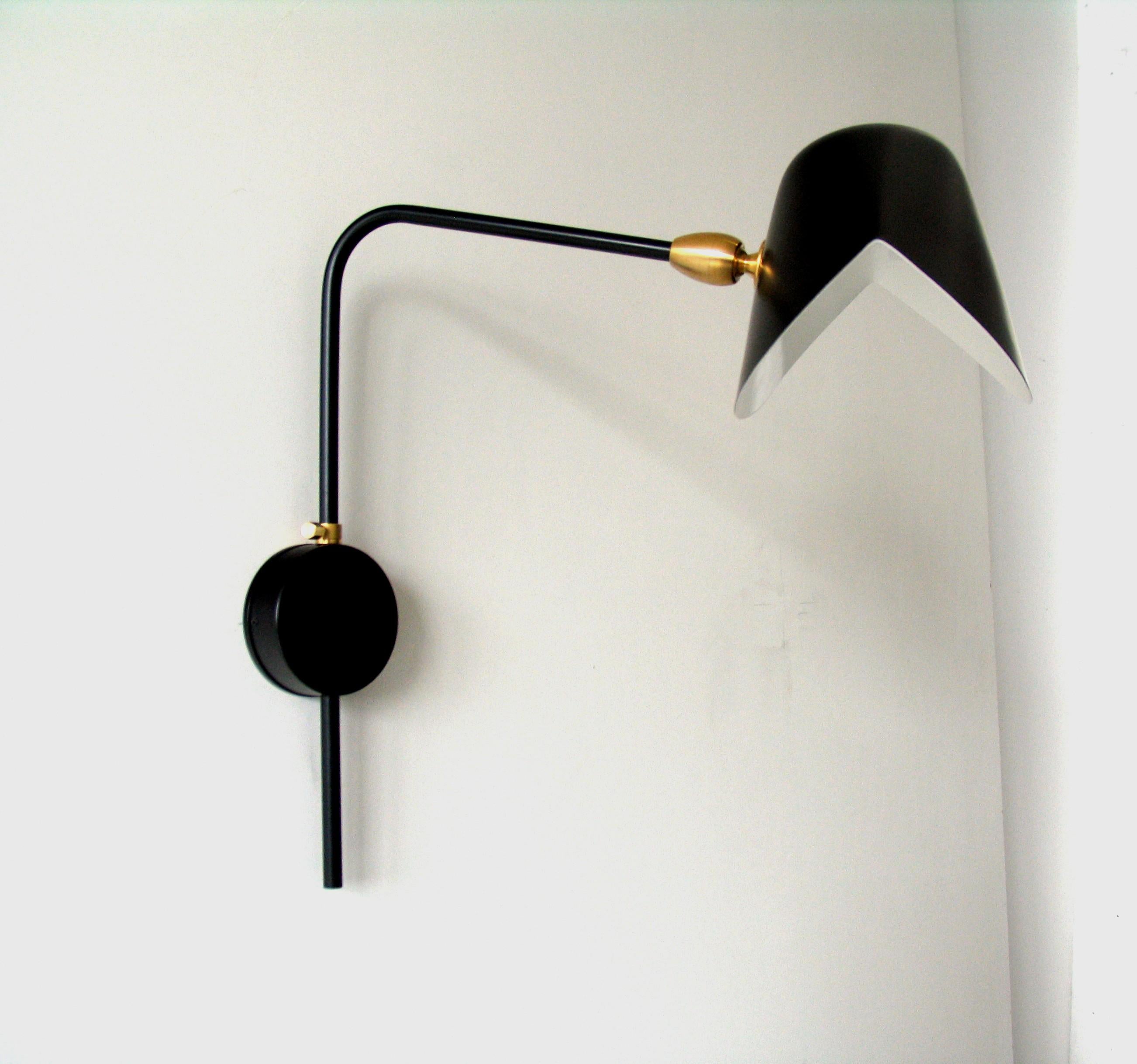 DESCRIPTION:
This sconce incorporates the “moule” or mussel shell shade, simple and natural in design. The shade is connected by a brass swivel and supported on a bent, rotating arm attached to the wall by a round mounting bracket.

COLOR