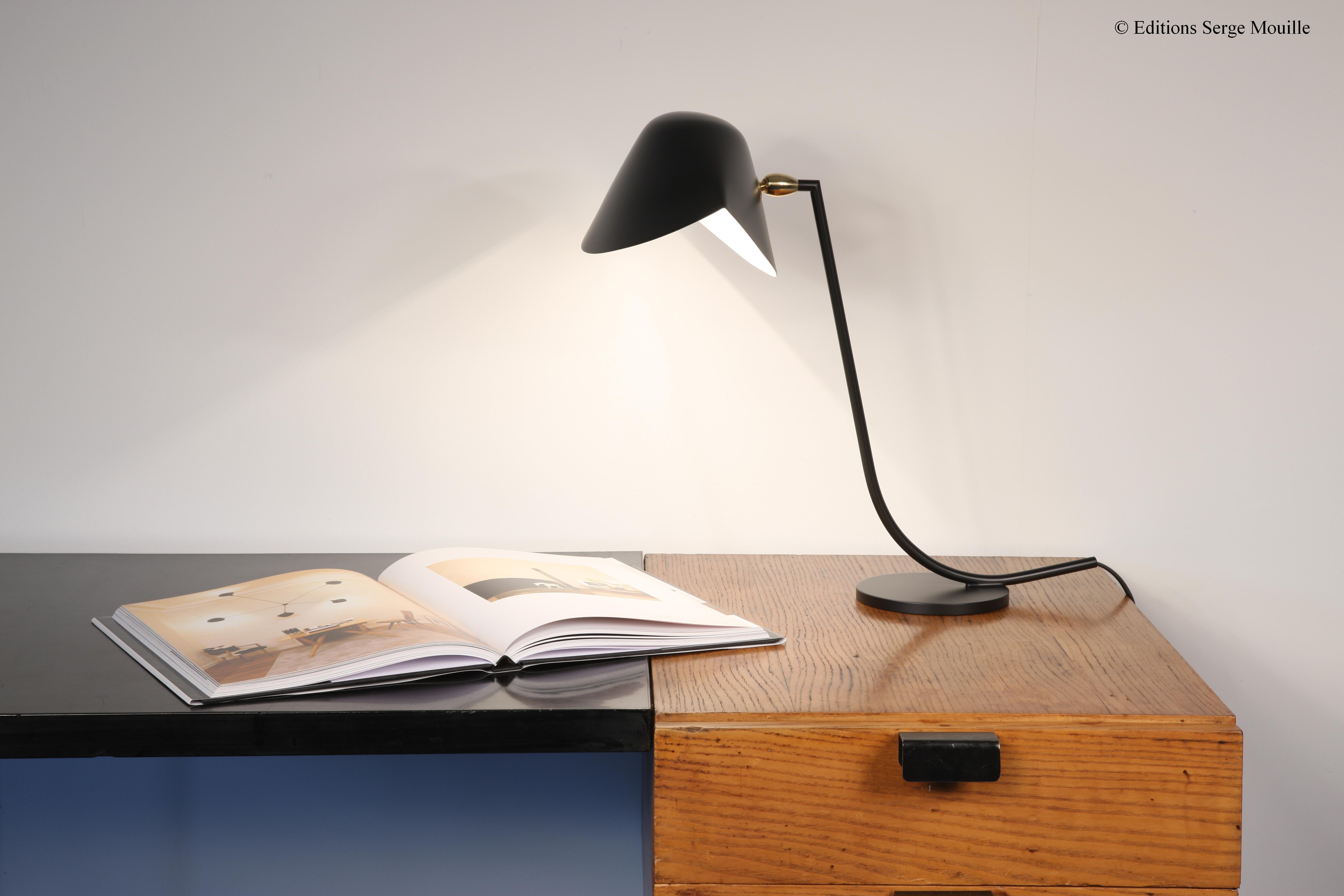 Serge Mouille 'Antony' table lamp in black.

Originally designed in 1955, this iconic lamp is still made by Edition Serge Mouille in France using many of the same small-scale manufacturing techniques and scrupulous attention to detail, materials