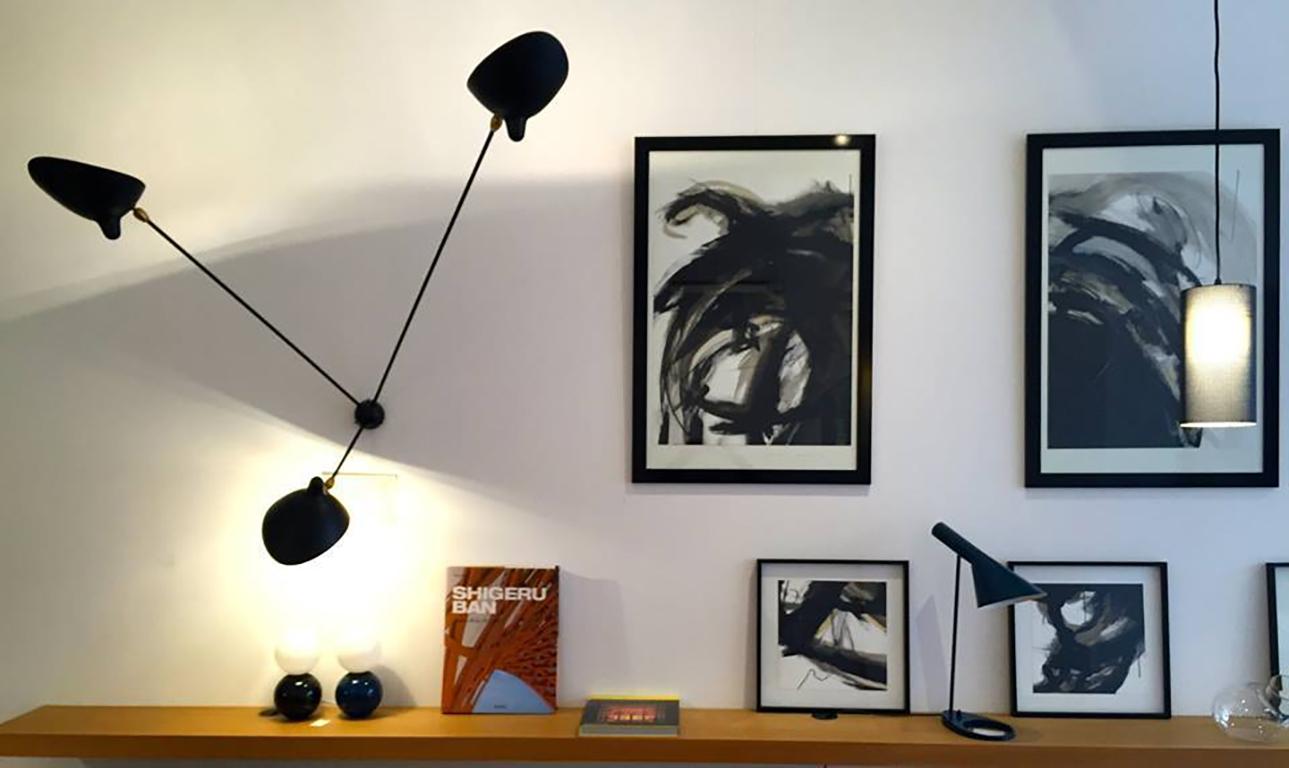 Serge Mouille 'Applique Araignée 3 Bras Fixes' wall light in black.

Originally designed in 1955, this monumental wall light is still made by Edition Serge Mouille in France using many of the same small-scale manufacturing techniques and