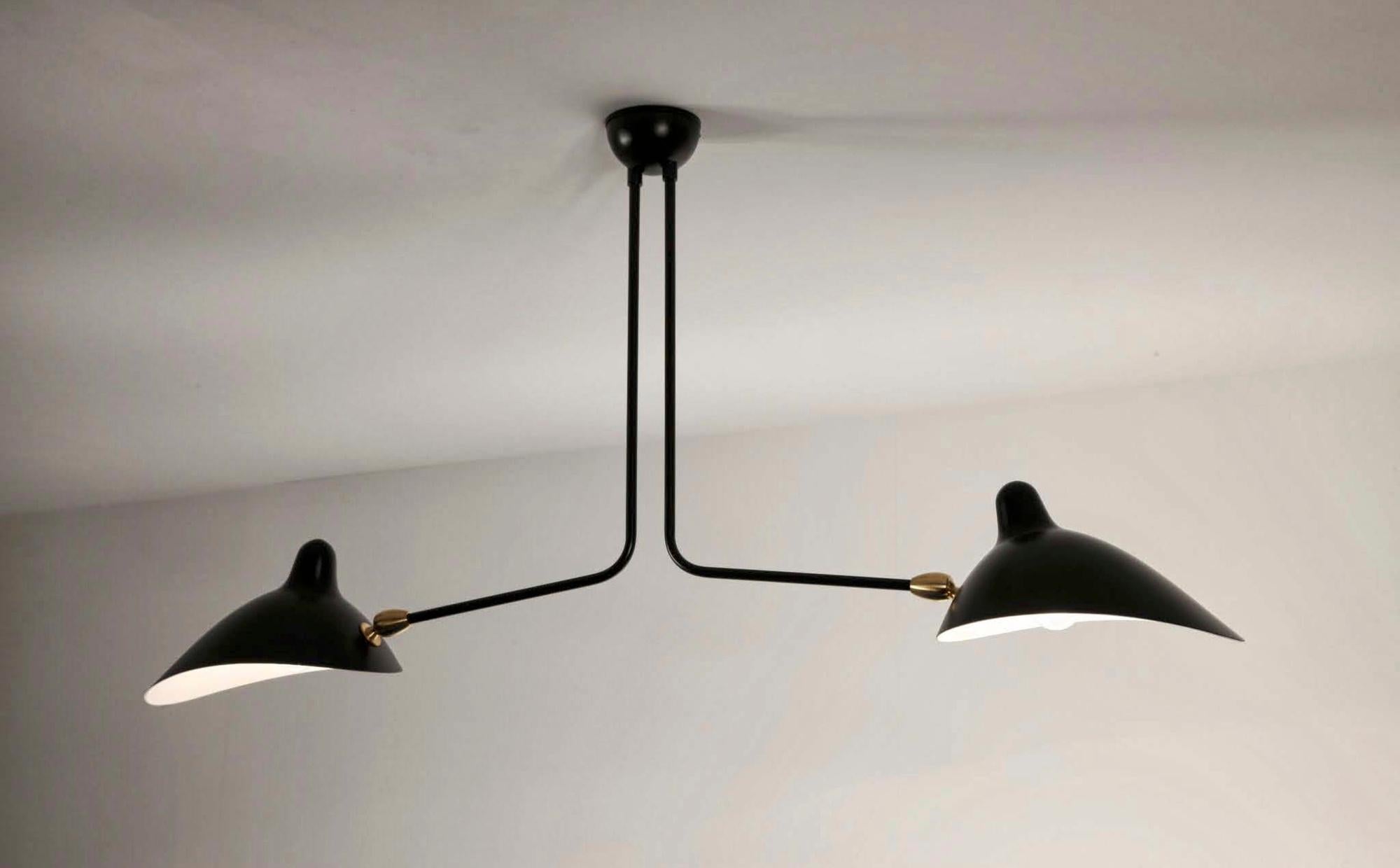 Simple and unique this ceiling lamp has two symmetrical curved arms which are fixed, with shades that can be rotated to any position. An elegant lamp with a small footprint that gives character to any room. 

Available in black or white.

WHAT SETS