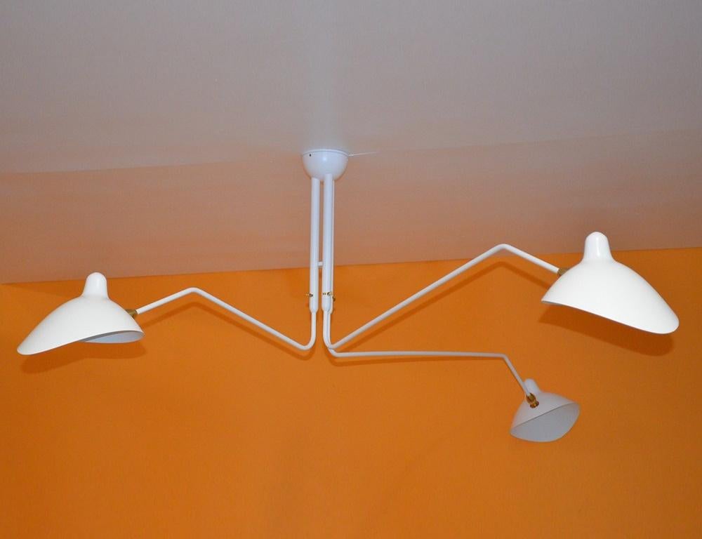 serge mouille three arm ceiling lamp