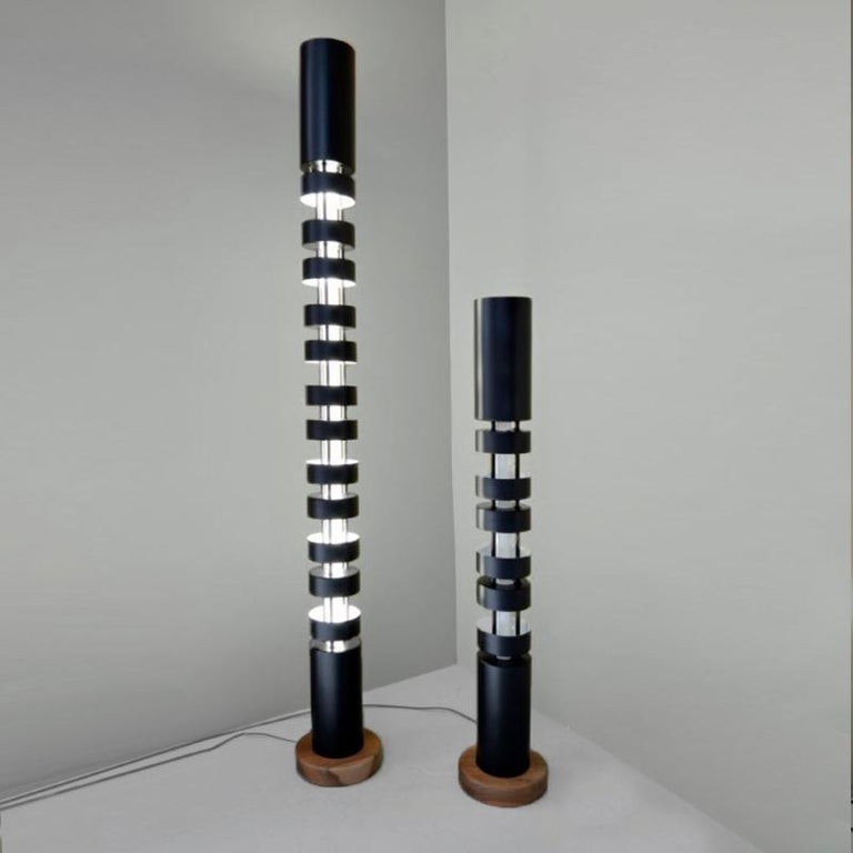 Floor lamp models 'Large Totem Column Lamp' and 'Small Totem Column Lamps' set designed by Serge Mouille in 1962.

Manufactured by Editions Serge Mouille in France. The production of lamps, wall lights and floor lamps are manufactured using