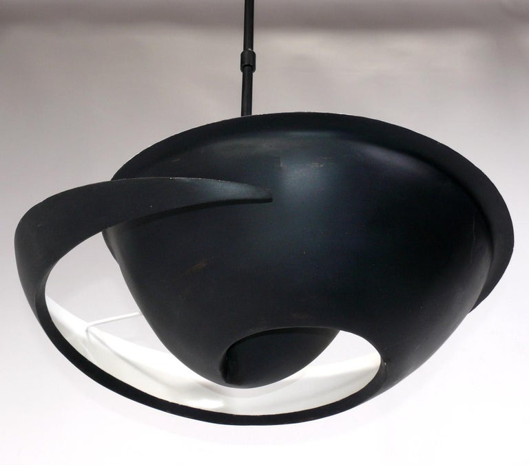 Sculptural Snail or Escargot model chandelier or pendant light, designed by Serge Mouille in the 1950s, this example is an authorized re-edition made by Gueridon, circa 21st Century. This example is currently $8000-9000 new. A snail shell provided