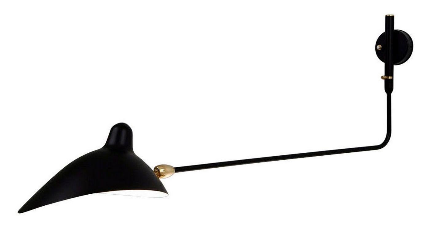 Licensed re-edition produced by the family of Serge Mouille on the site of his original workshop.

The shade tilts and revolves on a brass fitting while the arm swings providing a very versatile lighting option. Mostly used as a pair for bedside