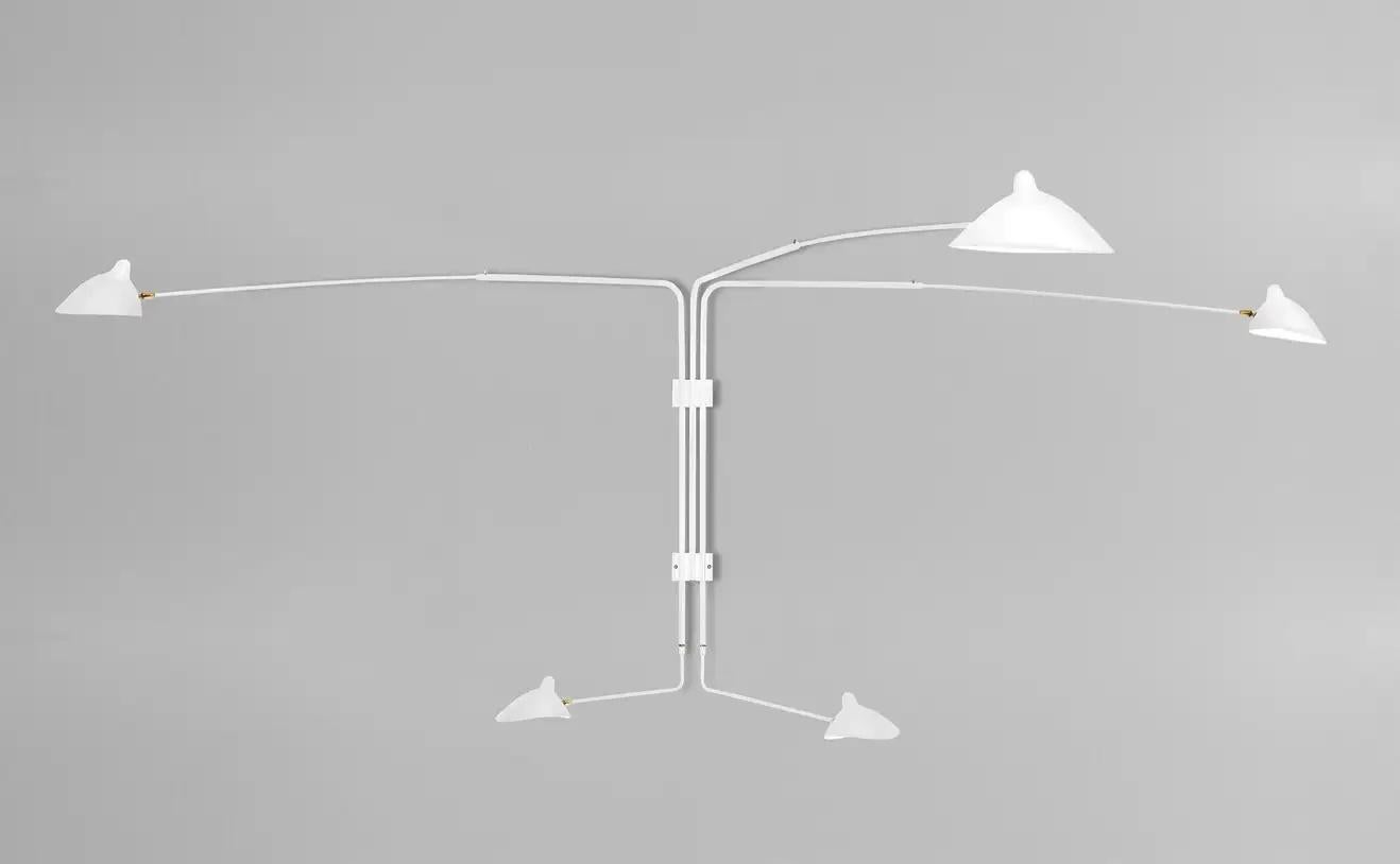 A larger sconce with two identical long arms and three shorter arms of varying lengths, this lamp can illuminate a large area of a wall or room. Each lamp head rotates and tilts.

Available in white or black with brass fittings.

COLOR