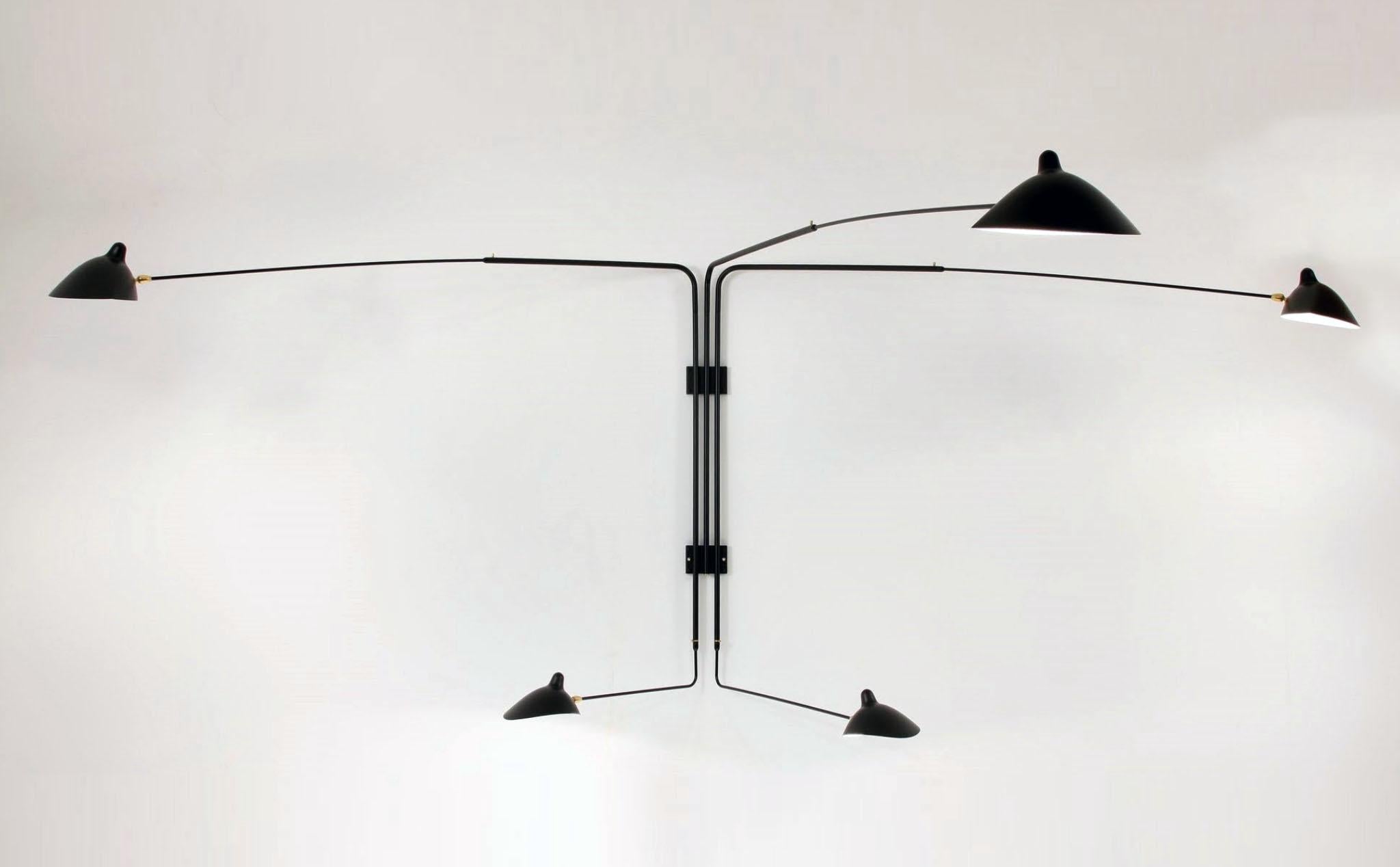 A larger sconce with two identical long arms and three shorter arms of varying lengths, this lamp can illuminate a large area of a wall or room. Each lamp head rotates and tilts.

Available in white or black with brass fittings.

COLOR