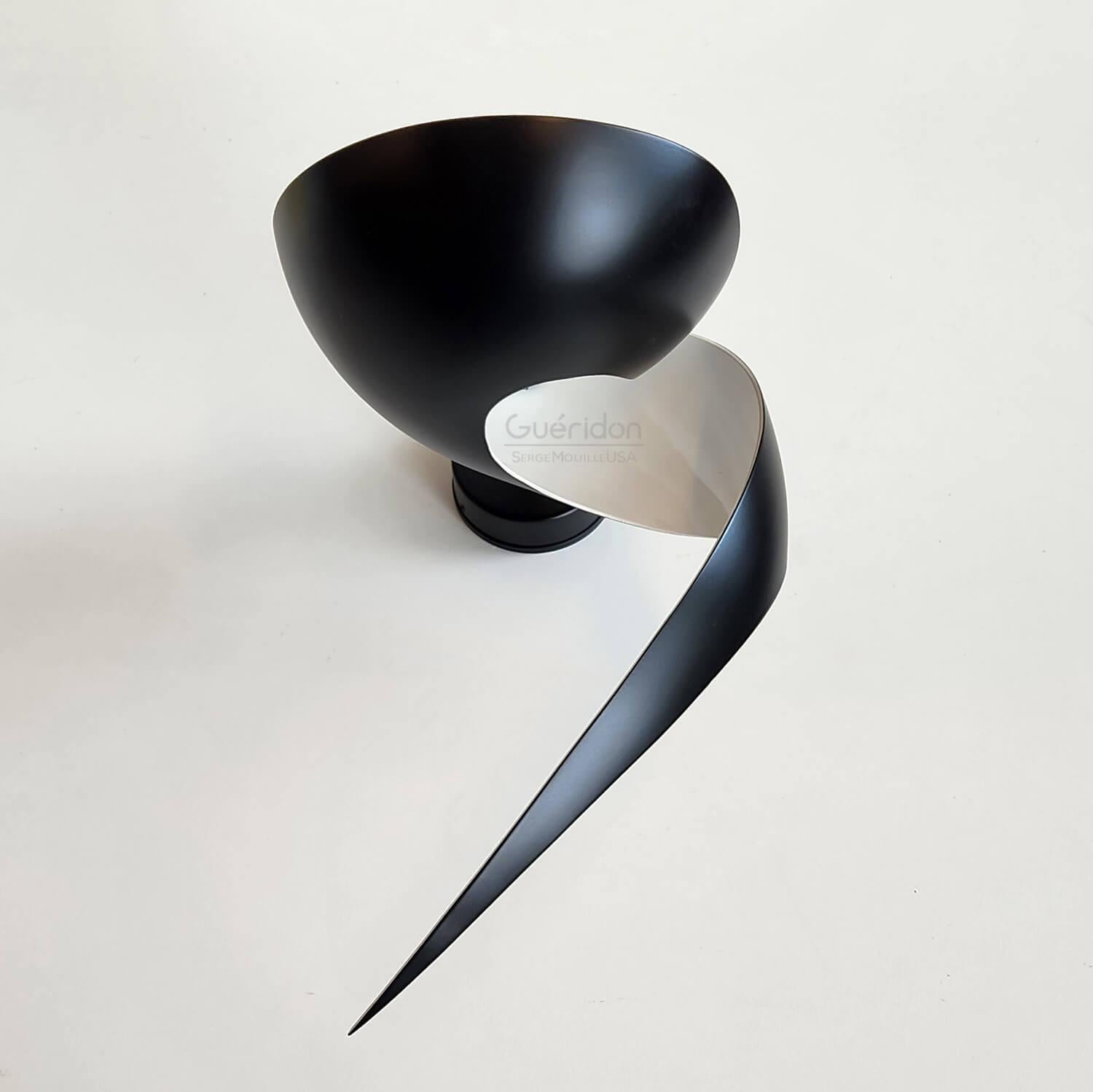 DESCRIPTION:
An elegant twist of metal results in a lamp that illuminates upwards while creating playful shadows through the elongated metal with a tapered ending. Unique, this lamp adds a distinctive touch to any setting. They can be used alone in