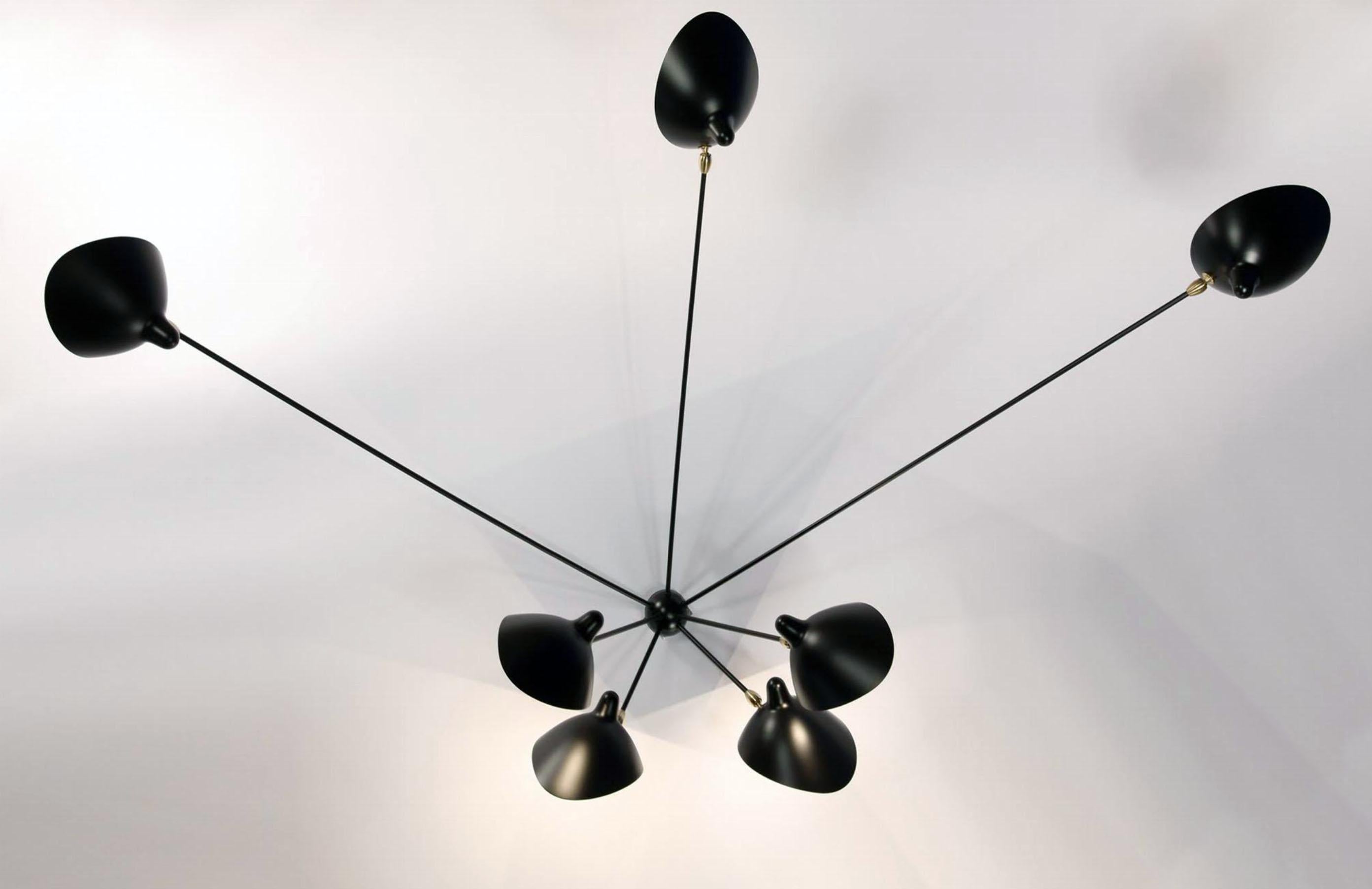 The largest of the spider sconces, this lamp is not only unique in its design but equally impressive in an installation where it is the focal point of the room. Two identically long arms, four identically short arms and one odd length give this lamp