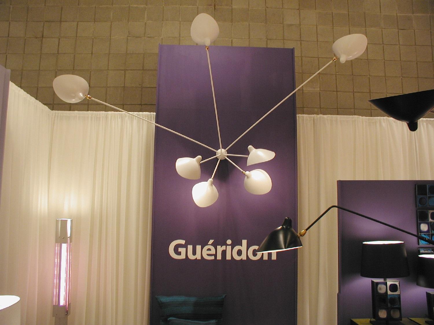 The largest of the spider sconces, this lamp is not only unique in its design but equally impressive in an installation where it is the focal point of the room. Two identically long arms, four identically short arms and one odd length give this lamp