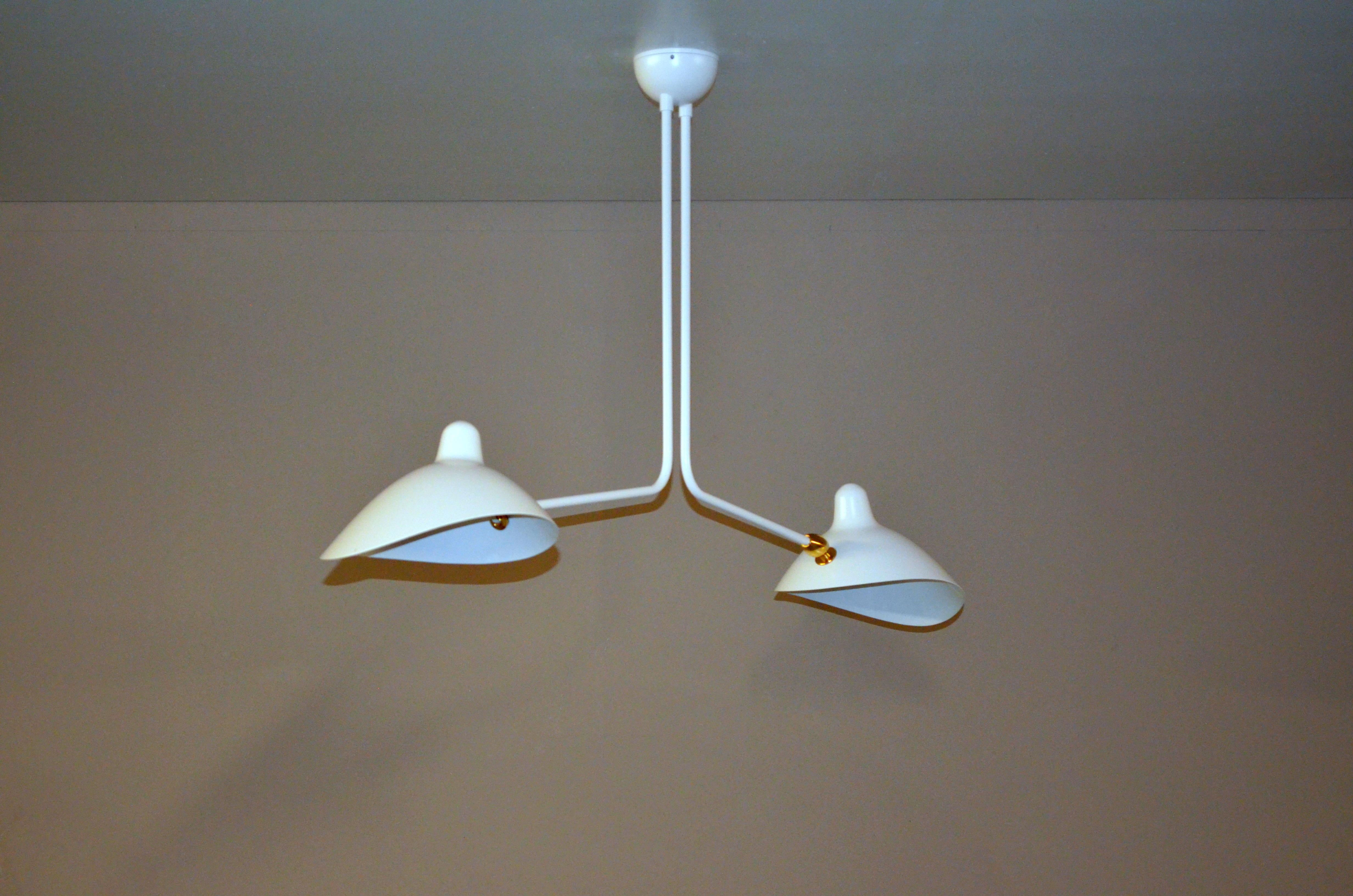 Simple and unique this ceiling lamp has two symmetrical curved arms which are fixed, with shades that can be rotated to any position. An elegant lamp with a small footprint that gives character to any room. 

Available in black or white.

You