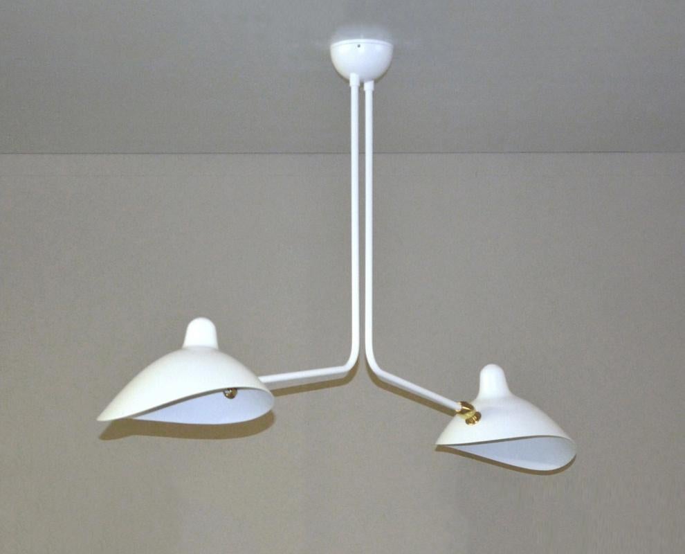 Simple and unique this ceiling lamp has two symmetrical curved arms which are fixed, with shades that can be rotated to any position. An elegant lamp with a small footprint that gives character to any room. 

You are buying a Mouille lamp, a