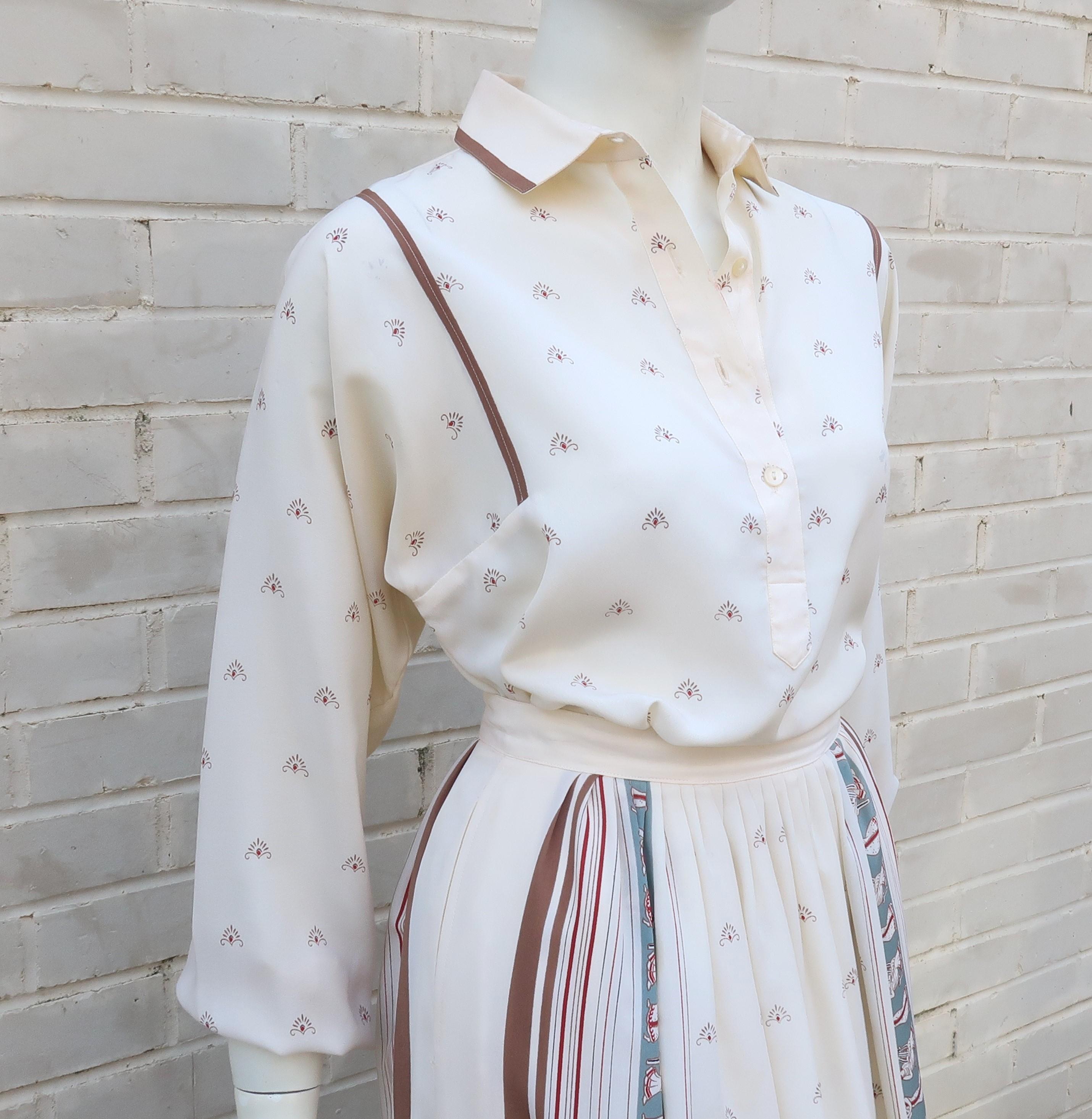 Serge Nancel French silk two piece dress including a top and coordinating skirt in shades of creamy white, light brown, oxblood and dove gray with a musical goddess motif.  The billowy top has a pullover construction with side vents and buttons half