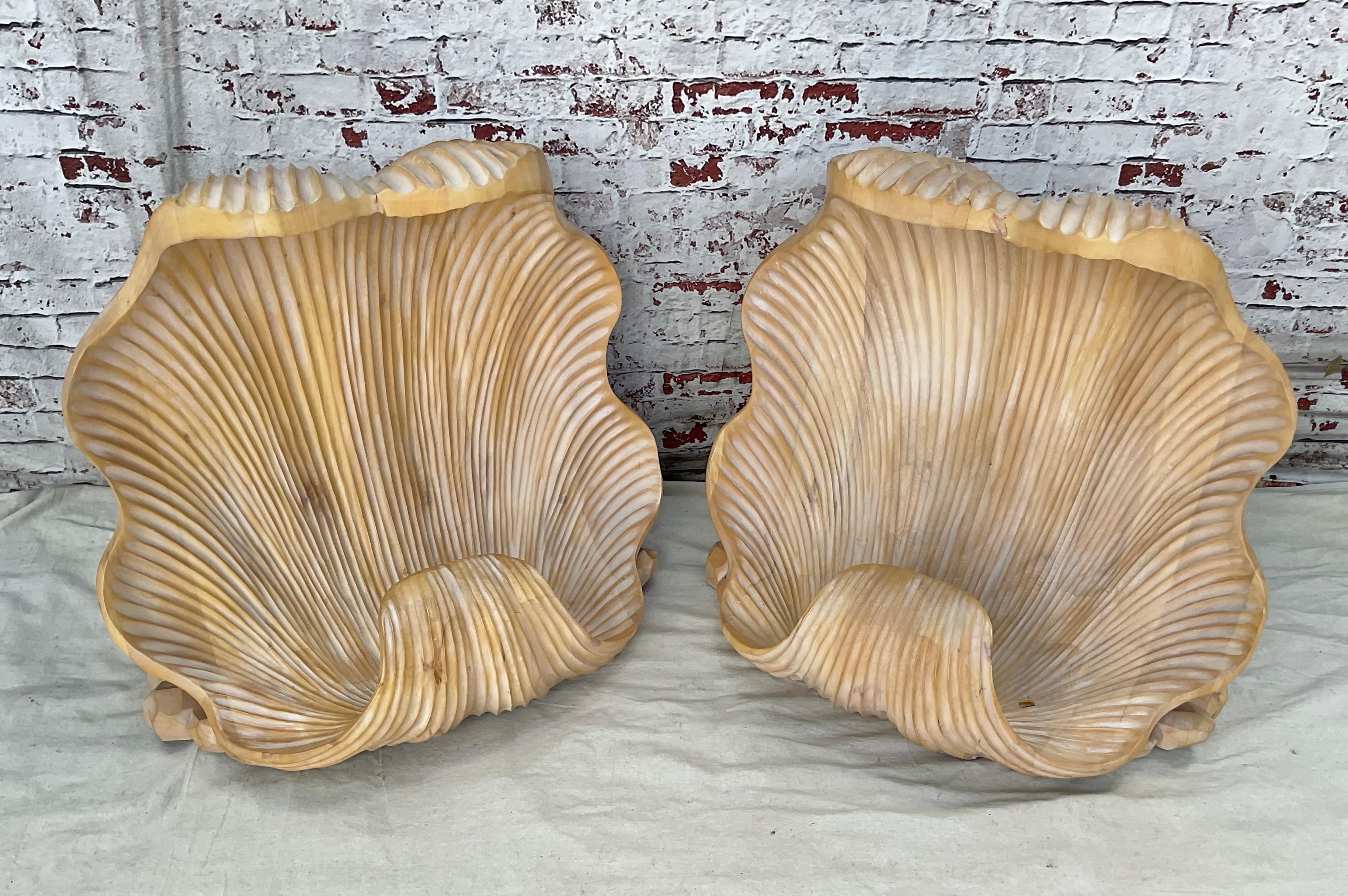 Large double base dining table features twin carved wood sea shell bases In the manner of Serge Roche. Bases in very good condition. Exquisitely crafted to resemble large clam shells and offer a seaside charm and stylish foundation for any tabletop