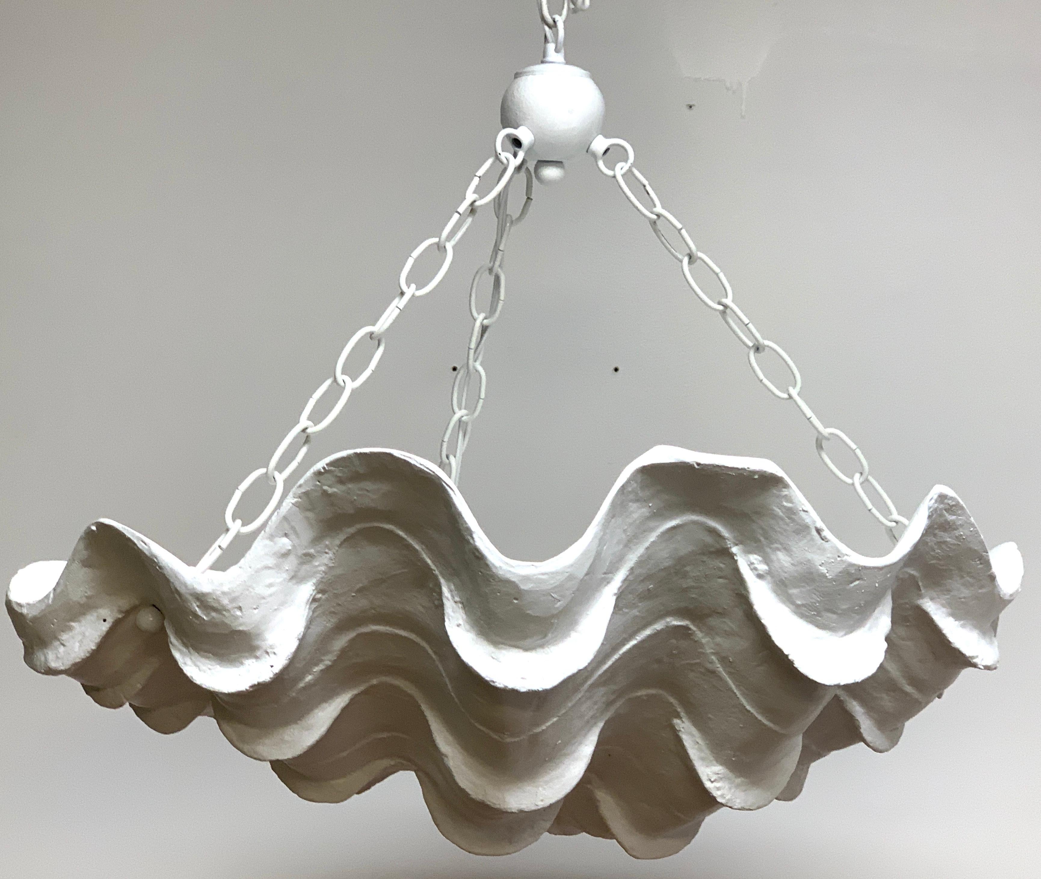 Serge Roche style clam shell chandelier, realistically modeled lacquered composition, gives off a nice soft light.
The shell measures 24