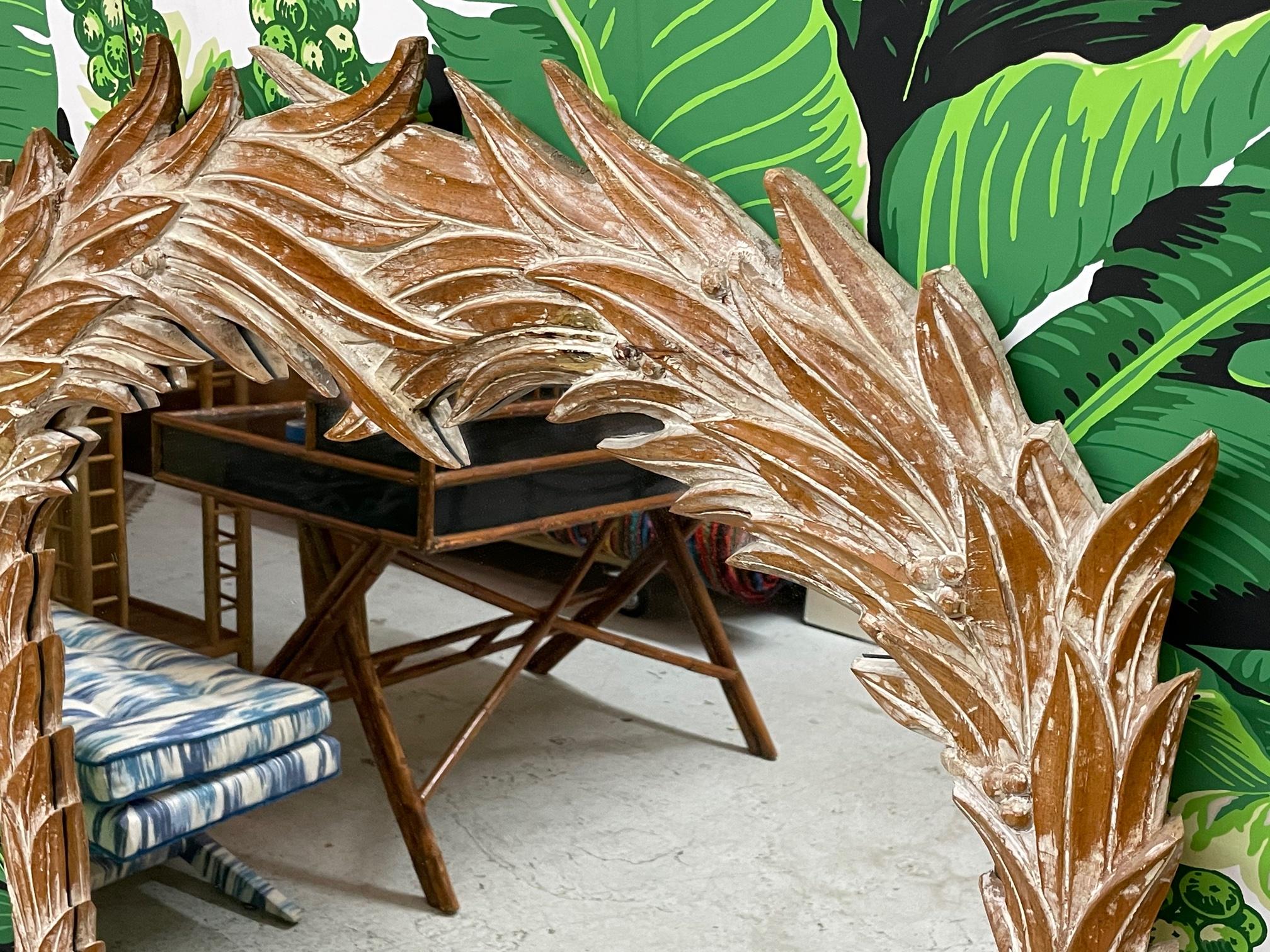 Vintage wall mirror in a palm frond motif by Serge Roche. Similar to styles of Dorothy Draper or John Dickinson. Carved wood in a cerused finish. Marked 