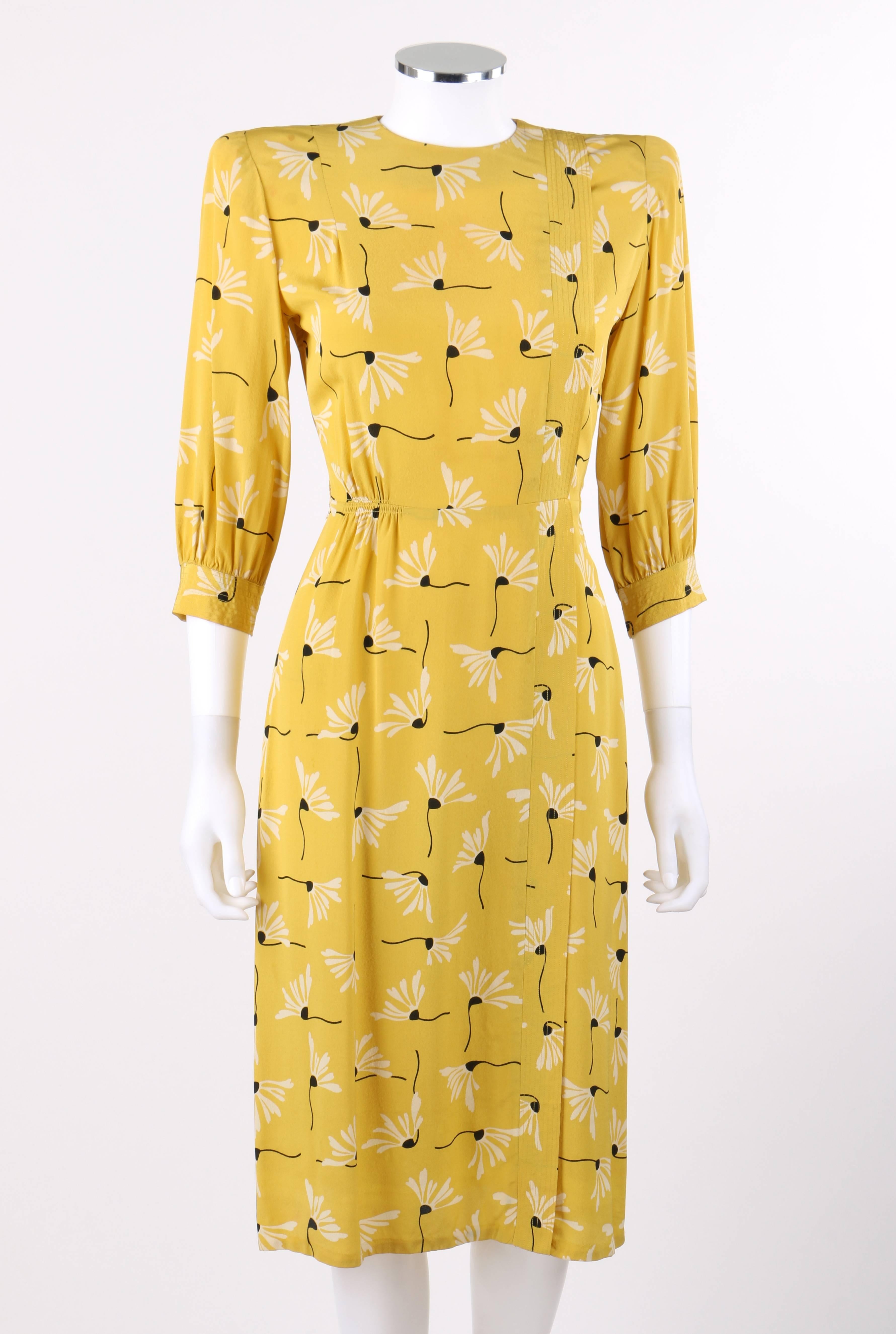 Vintage Sergee of California c.1940's yellow daisy print rayon crepe day dress. White and black all over daisy floral print on yellow rayon crepe. Crew neckline. 3/4 sleeves lightly gathered at cuff. Left front thin overlay from shoulder to hem with