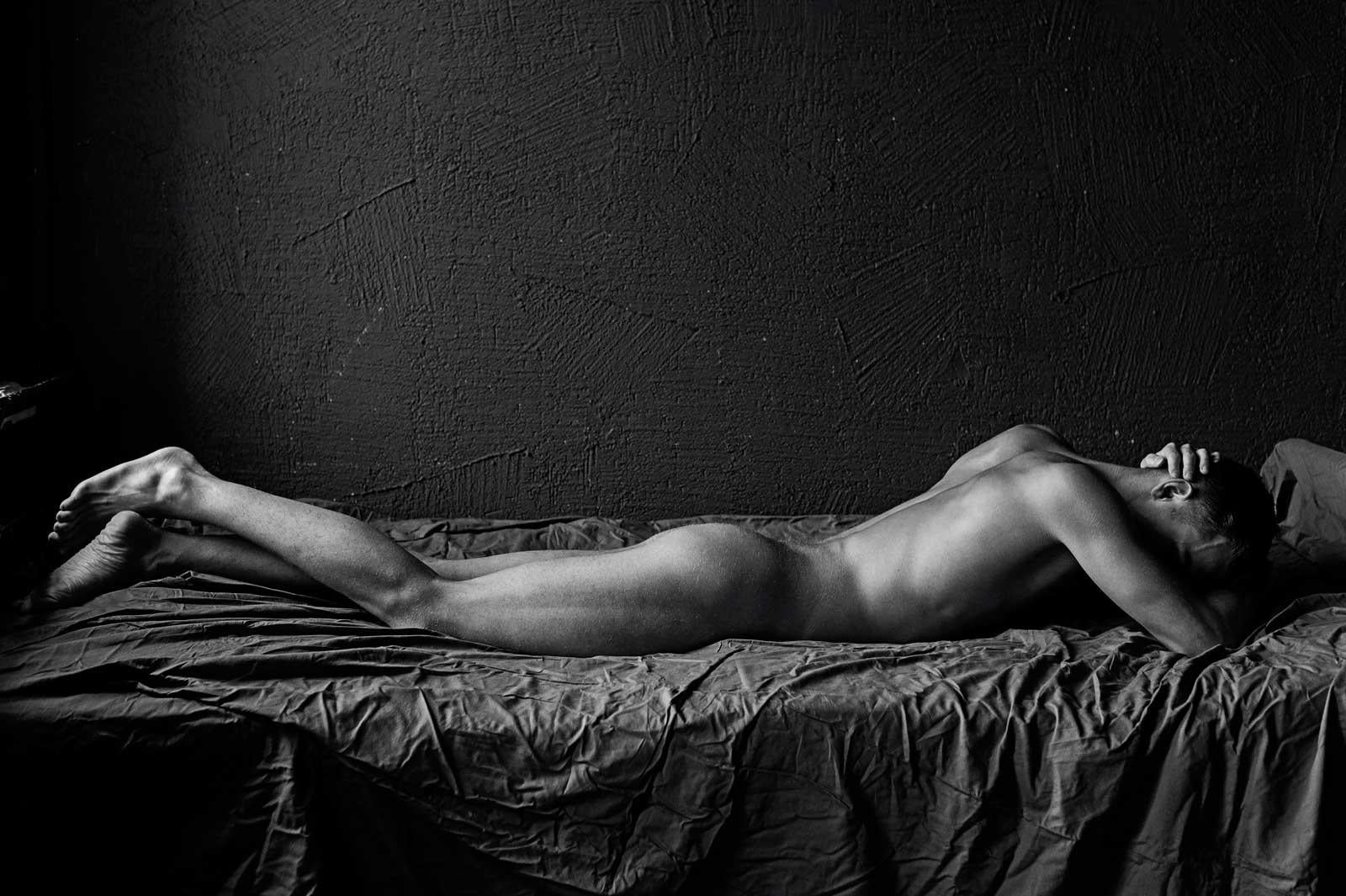 Sergey Vinogradov Figurative Print - Tommy (Nude male lies prone in a Vogue Italia shoot)