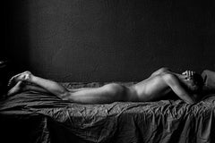 Tommy (Nude male lies prone in a Vogue Italia shoot)