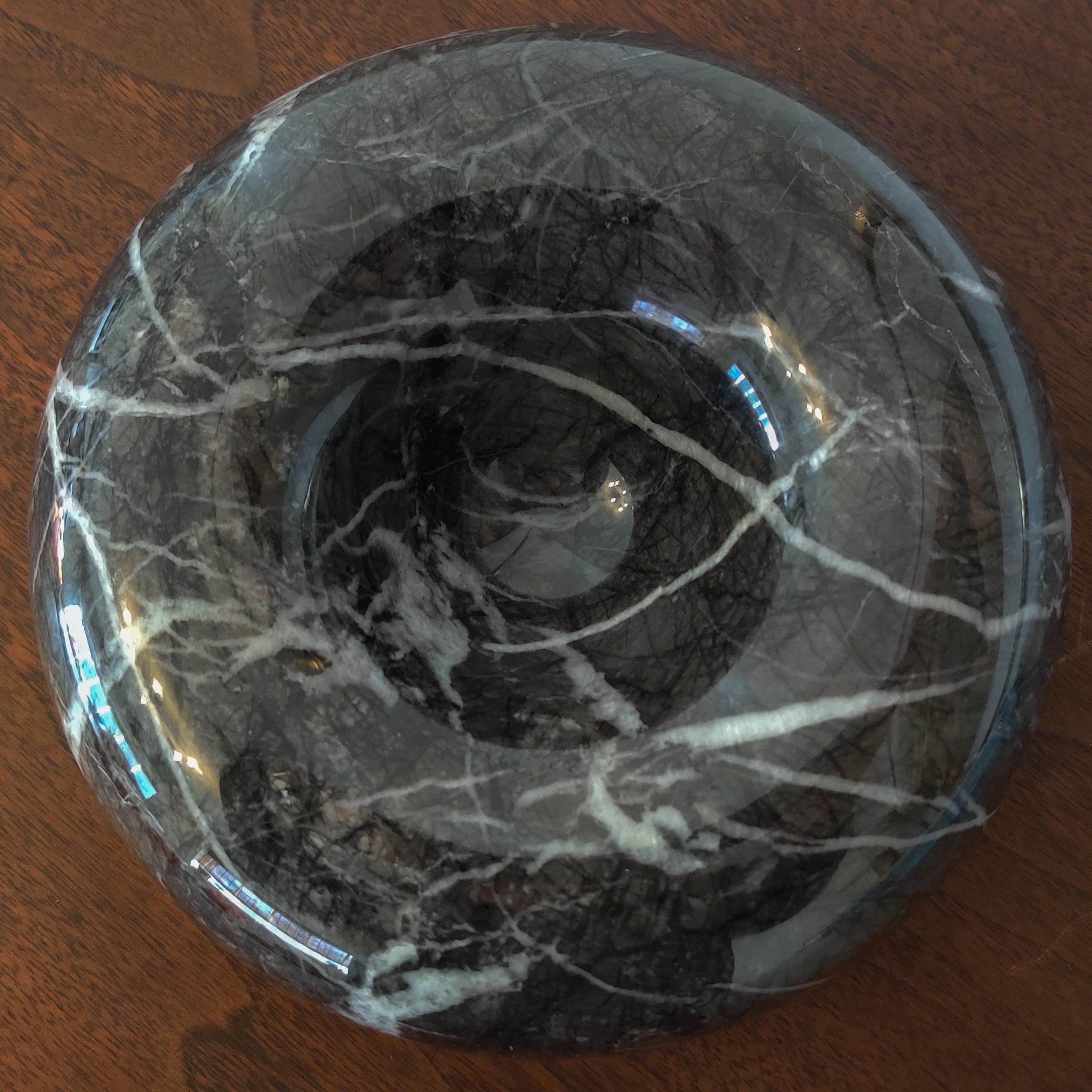 This black and white veined marble bowl was made by Atelier International for Up & Up and designer Sergio Asti. It is heavy and solid and makes for a great spot to store common houshold or office items or even another decorative object.

Condition