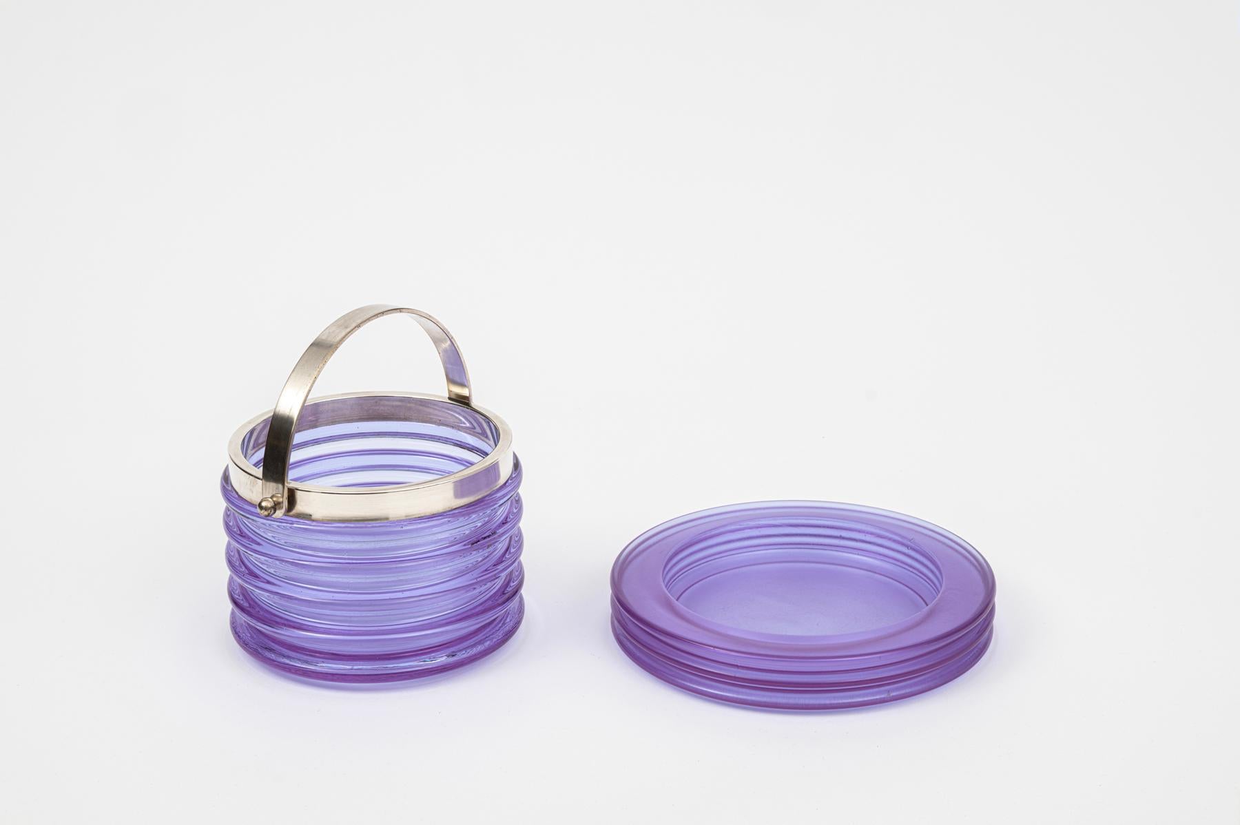 Sergio Asti for Arnolfo di Cambio.   

Violet glass ice bucket with silver handle.

With matching dish /vide poche  Italy c1970

vide poche 20.5 x 3.3

ice bucket 20cm with handle up
10.5 (h) x 18.3cm (w)