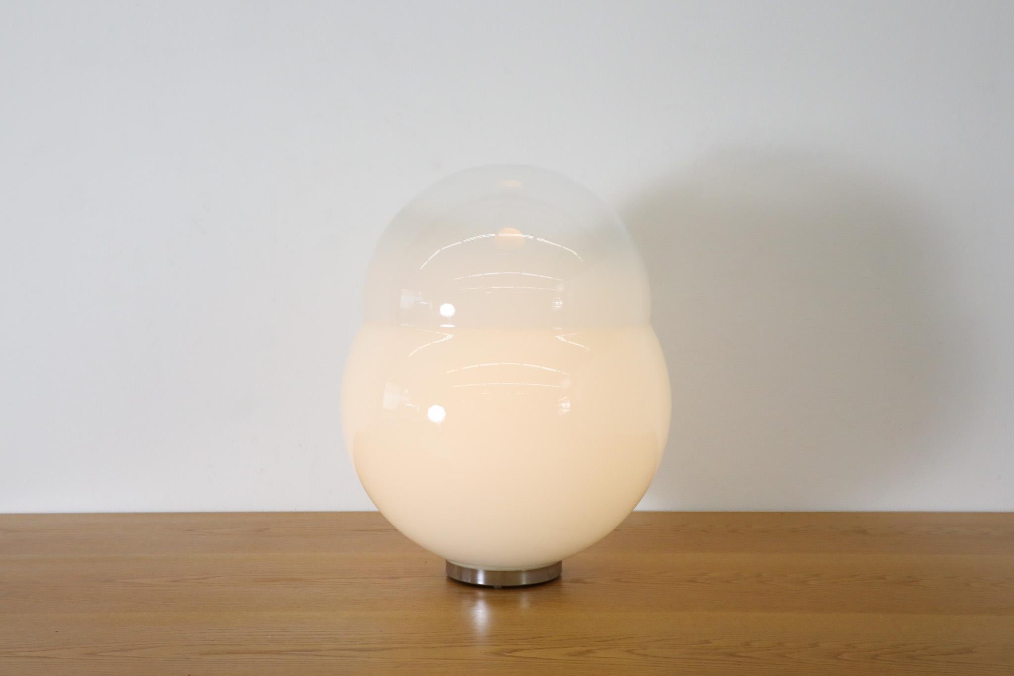 Incredible blown glass Sergio Asti for Fontana Arte style, snow globe table lamp. Made in Italy in the 1960s. Large, doubled gradient milk glass shade with chrome base and medium sized LED bulb. In original condition with wear consistent with age